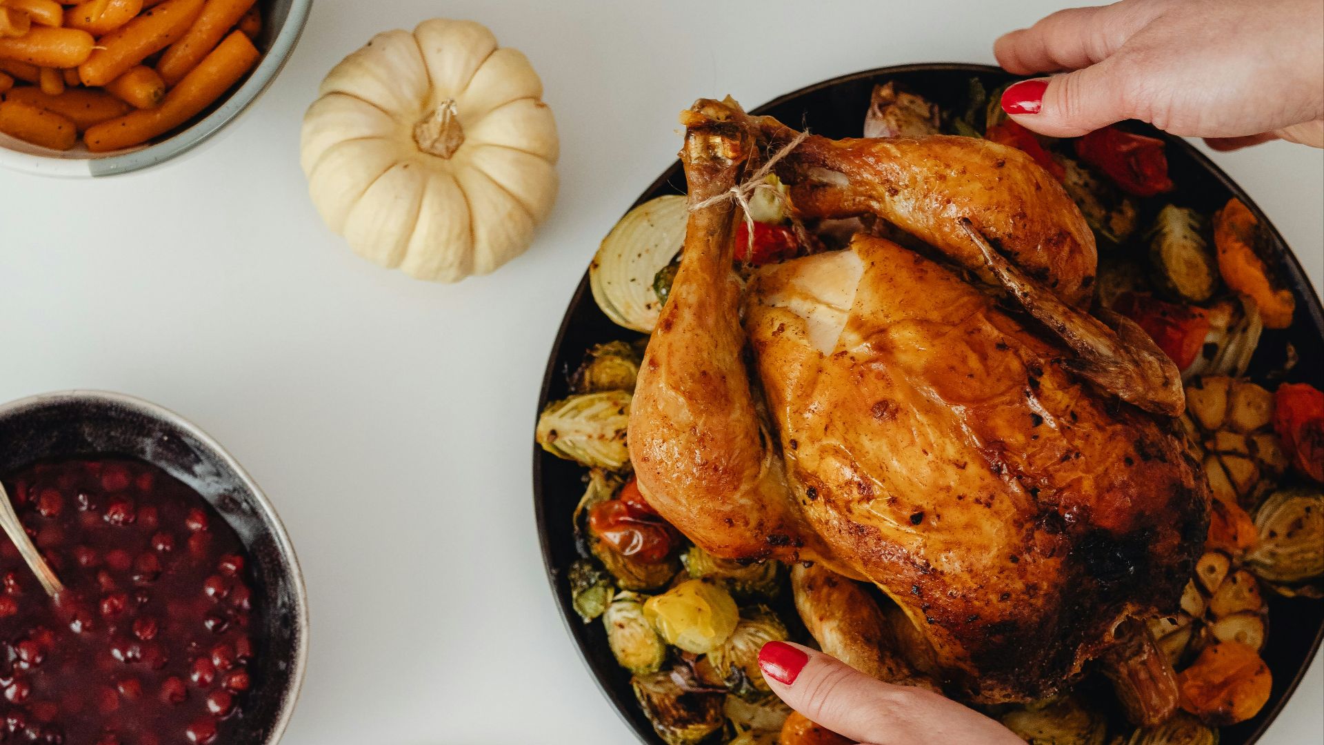 a person holding a plate of food