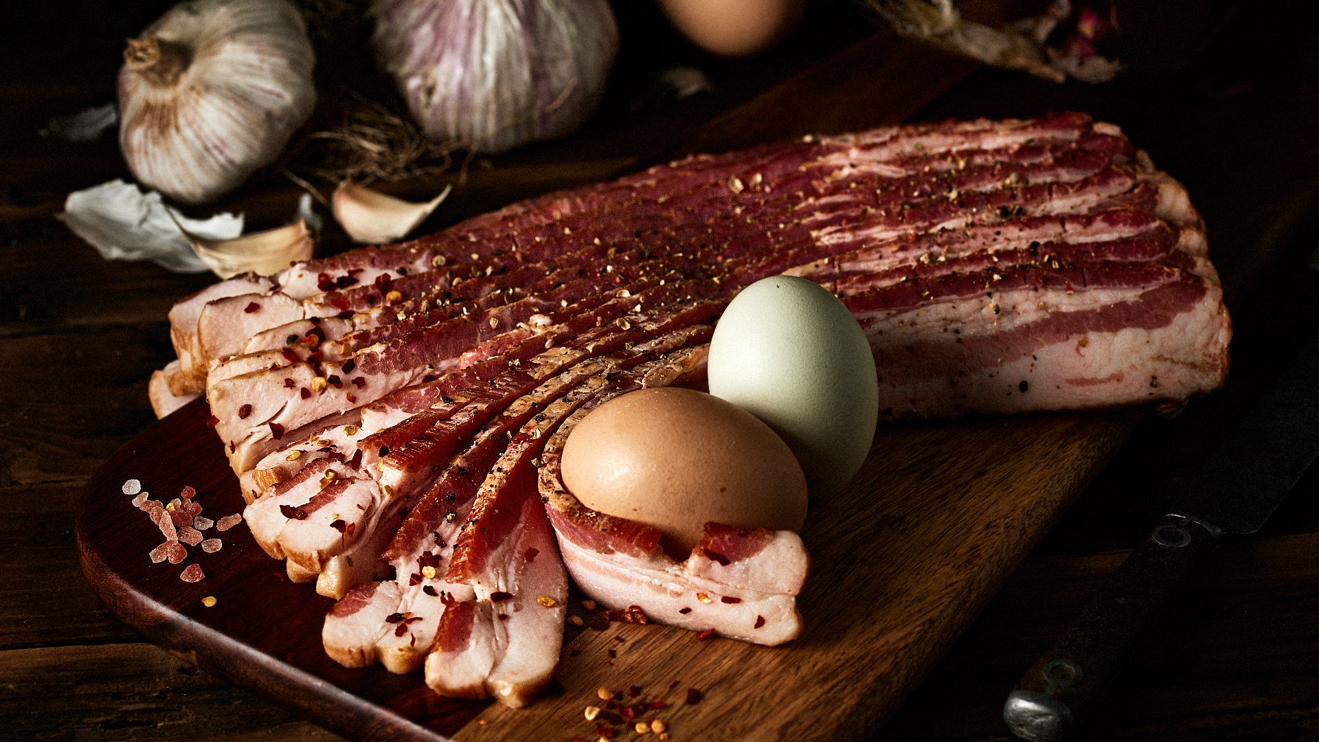 white egg on brown wooden chopping board