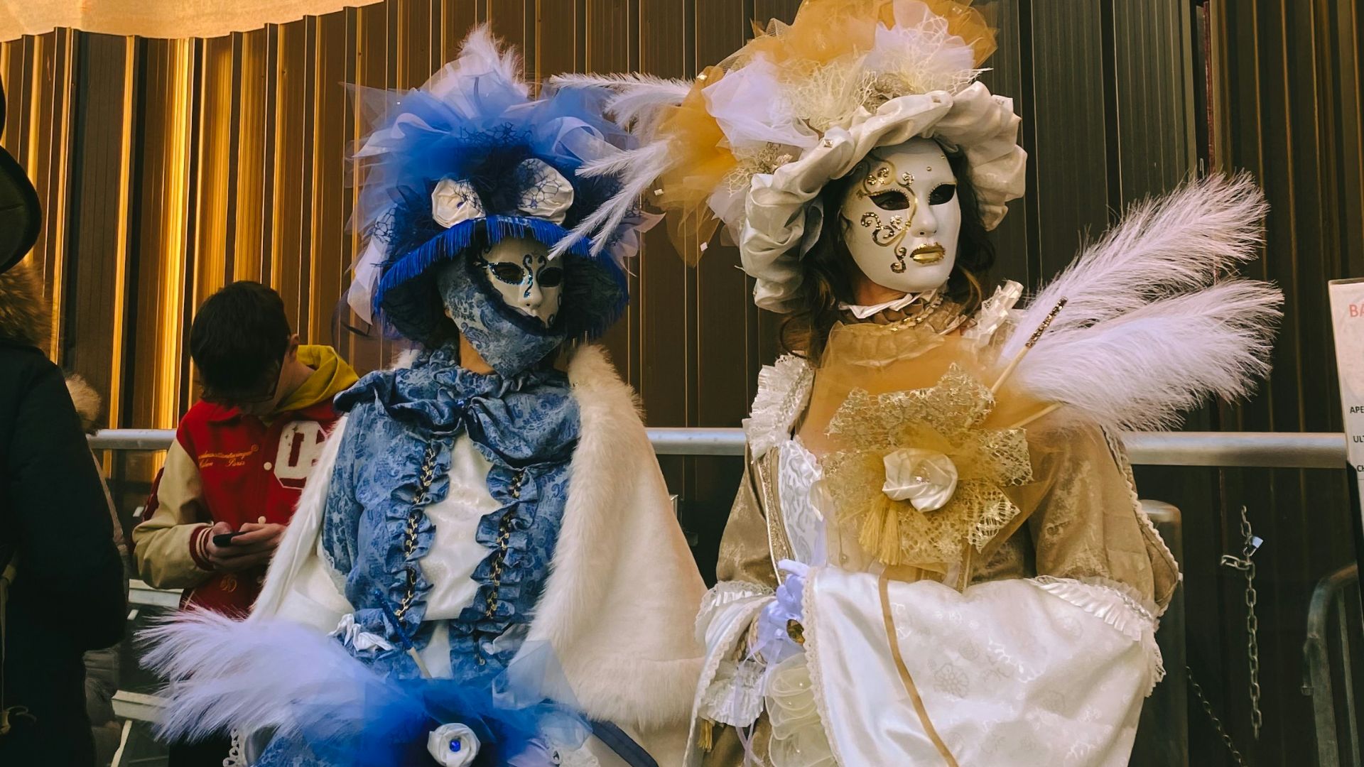 a couple of people that are standing in front of a building