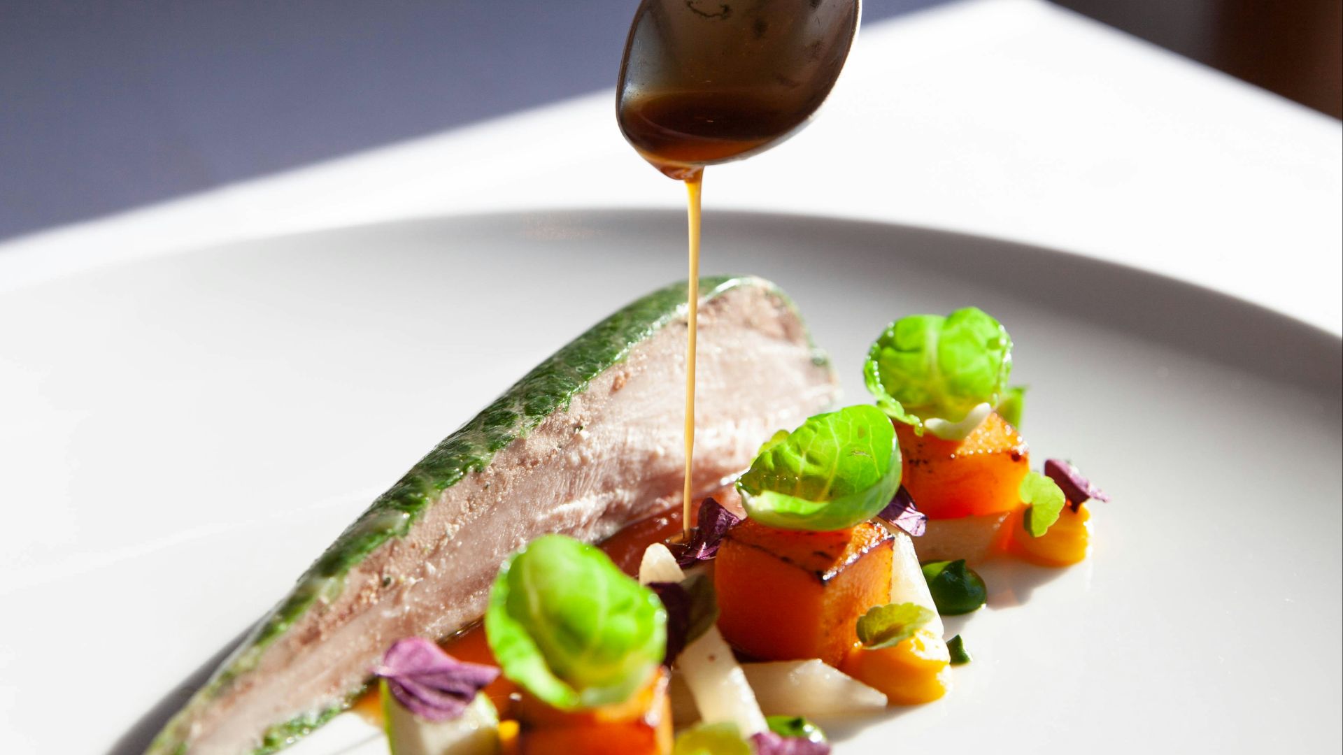 person holding stainless steel spoon