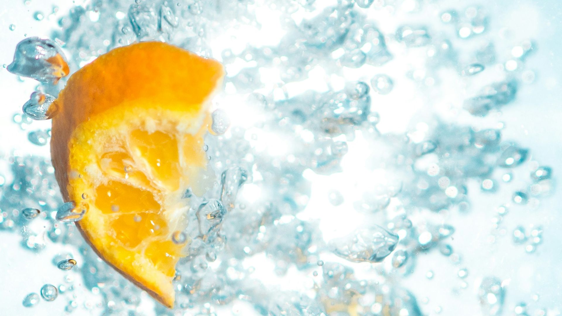 sliced orange fruits underwater