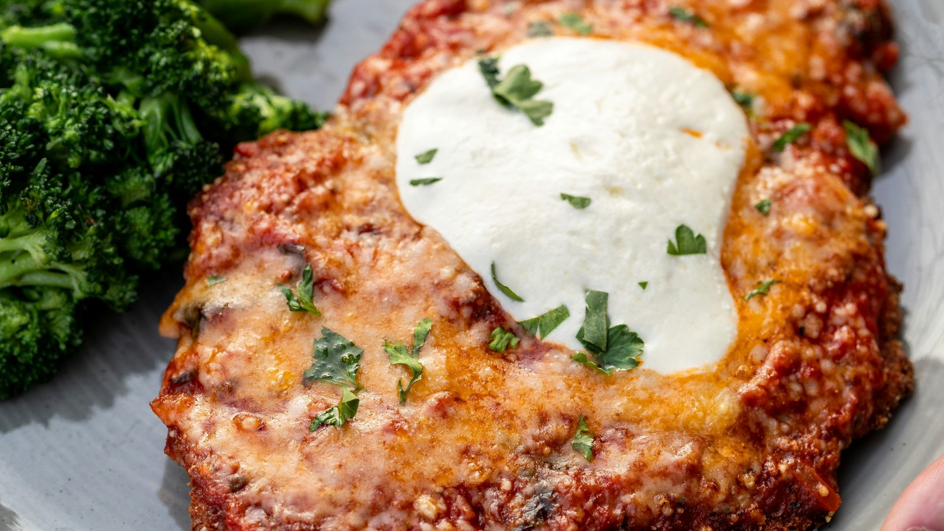 a plate of food with meat and broccoli