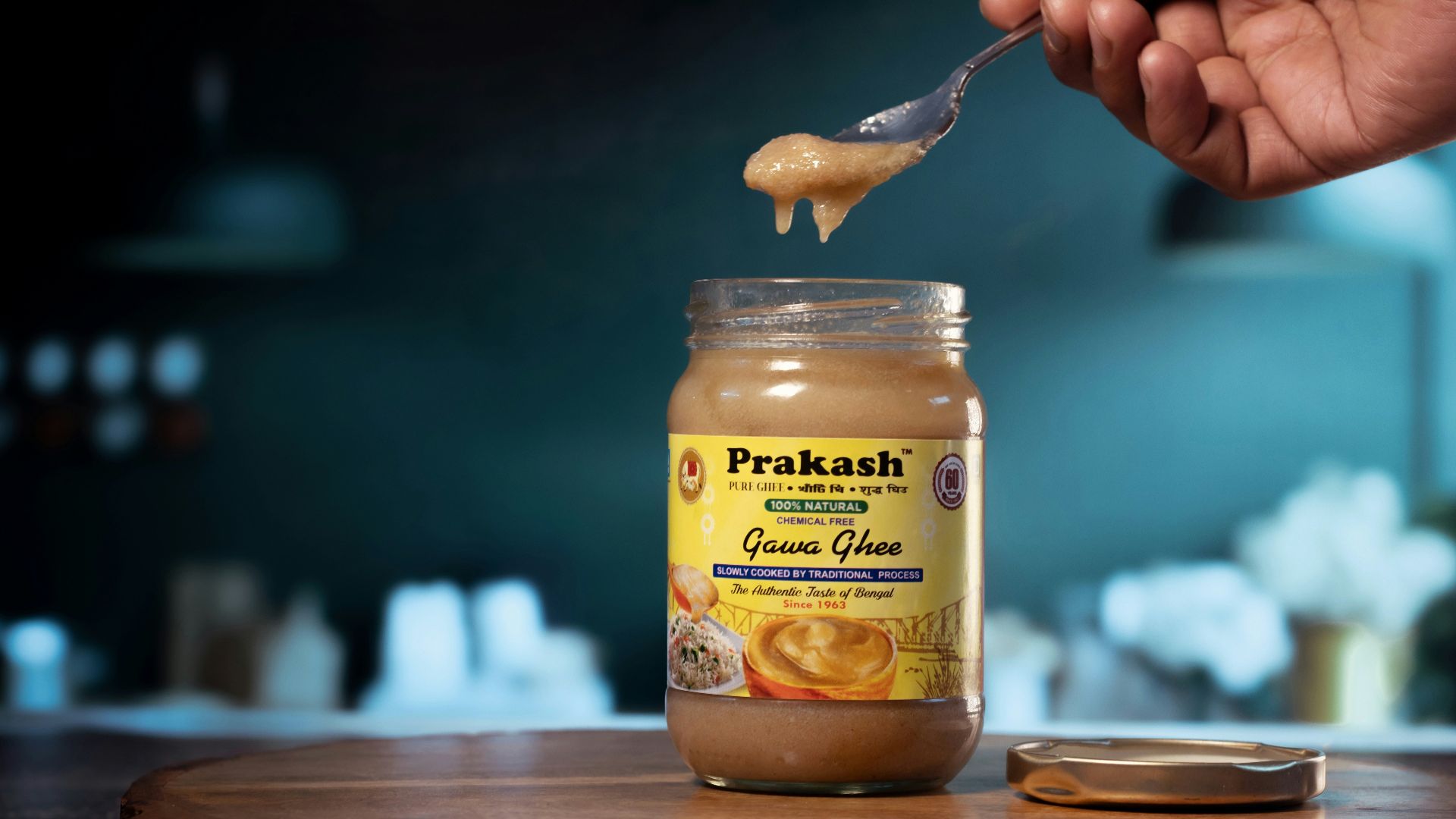 a jar of peanut butter being spooned with a spoon