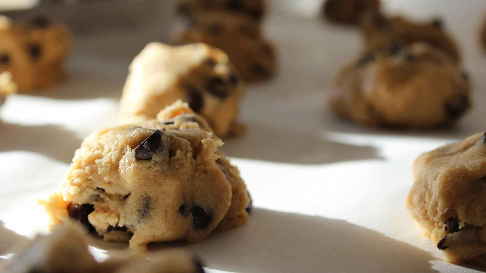 round chocolate cookies on white surface