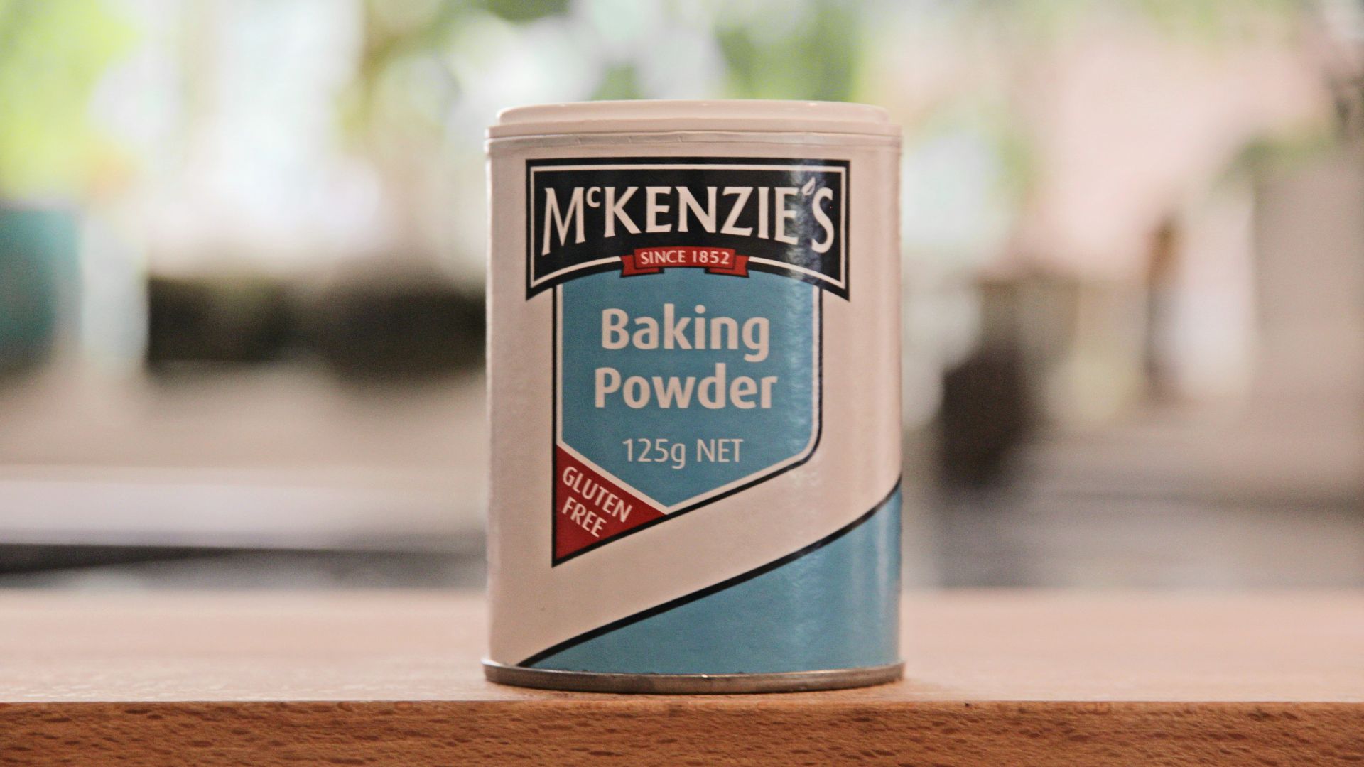 a can of baking powder sitting on a table