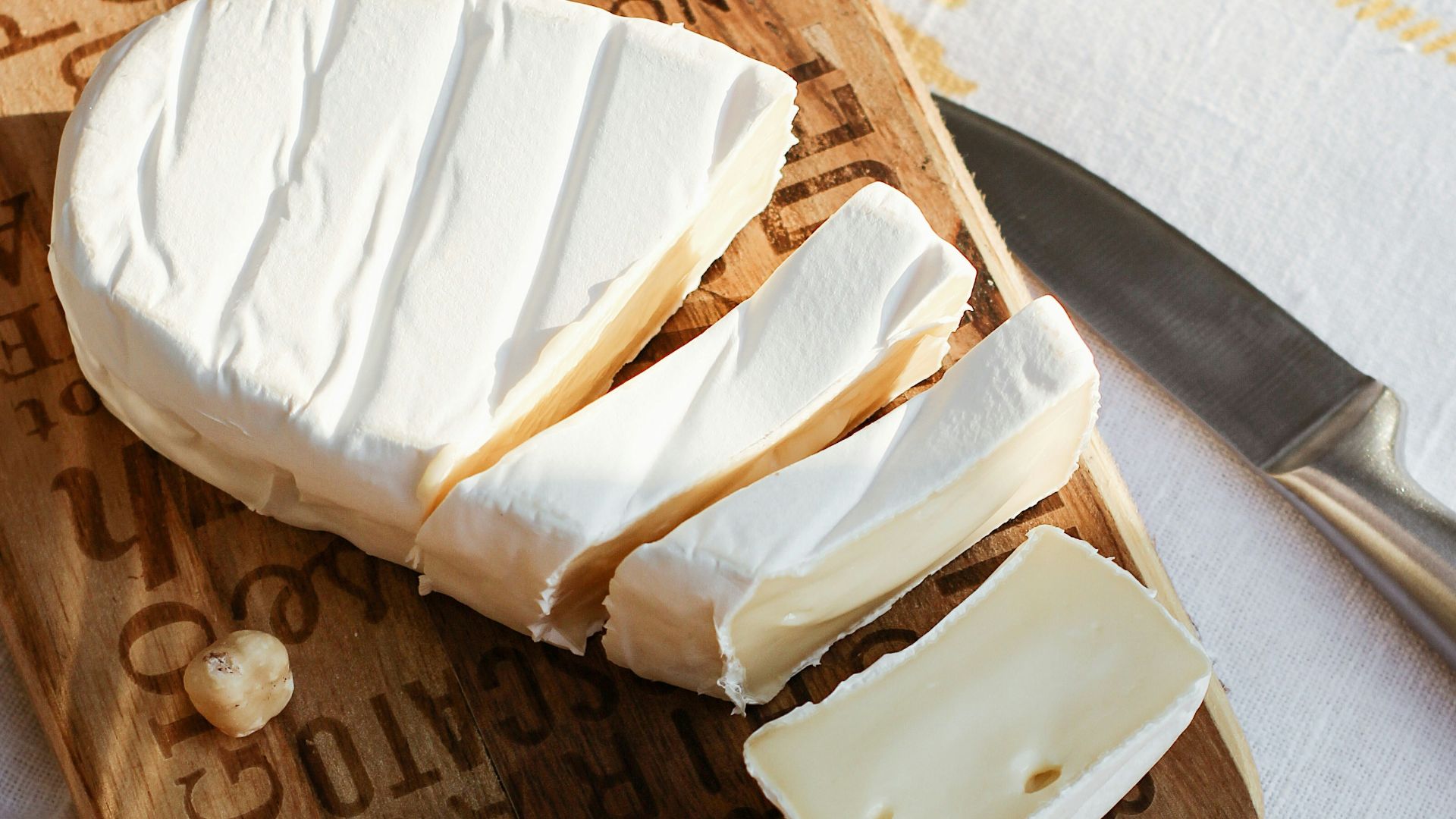 sliced bread on brown wooden chopping board