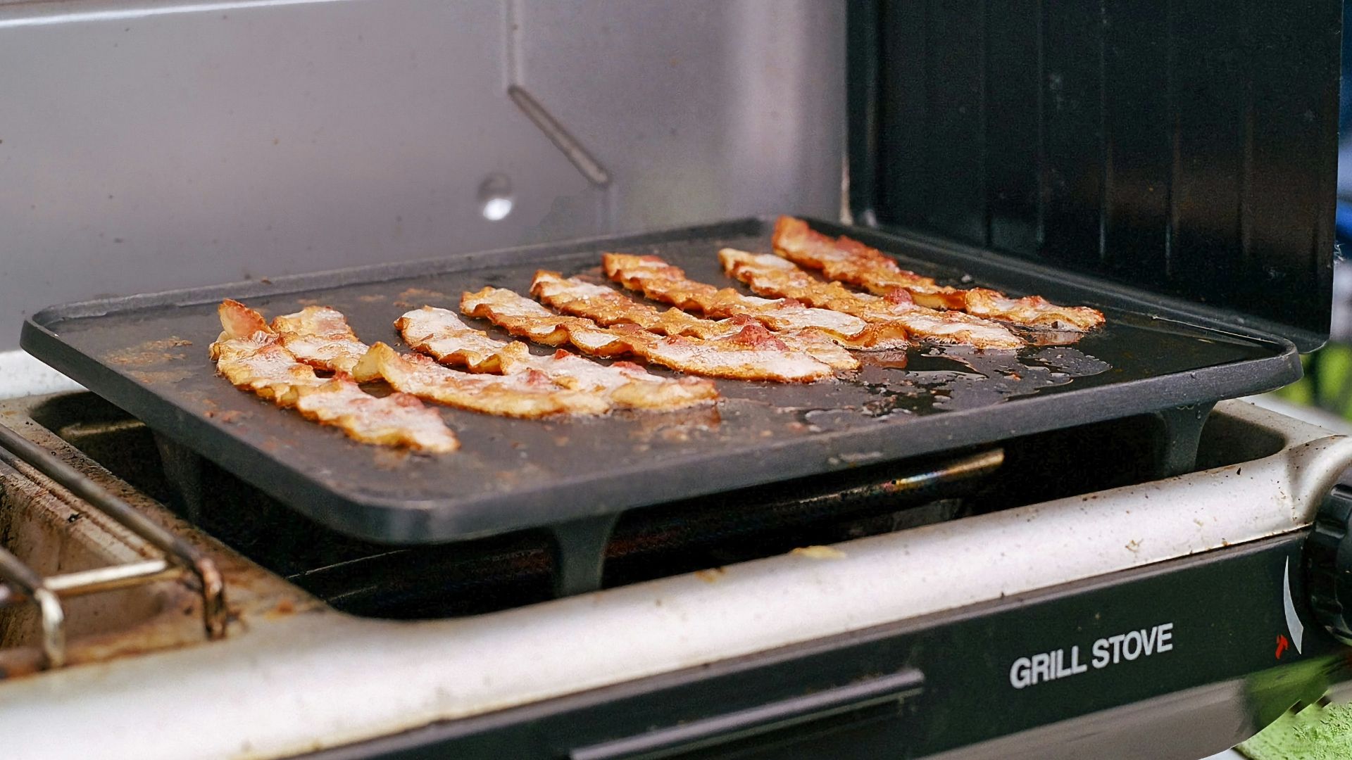 a grill that has some meat on it