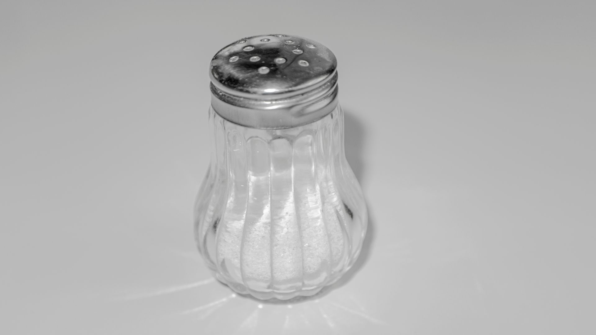 a salt shaker sitting on top of a table