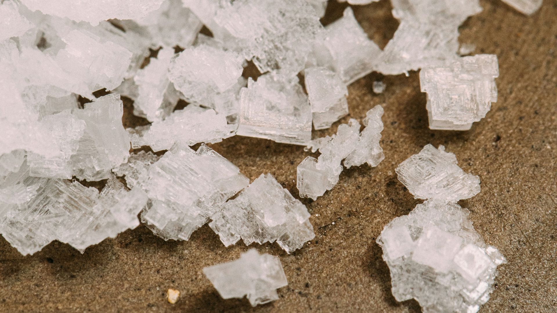 white snow on brown sand