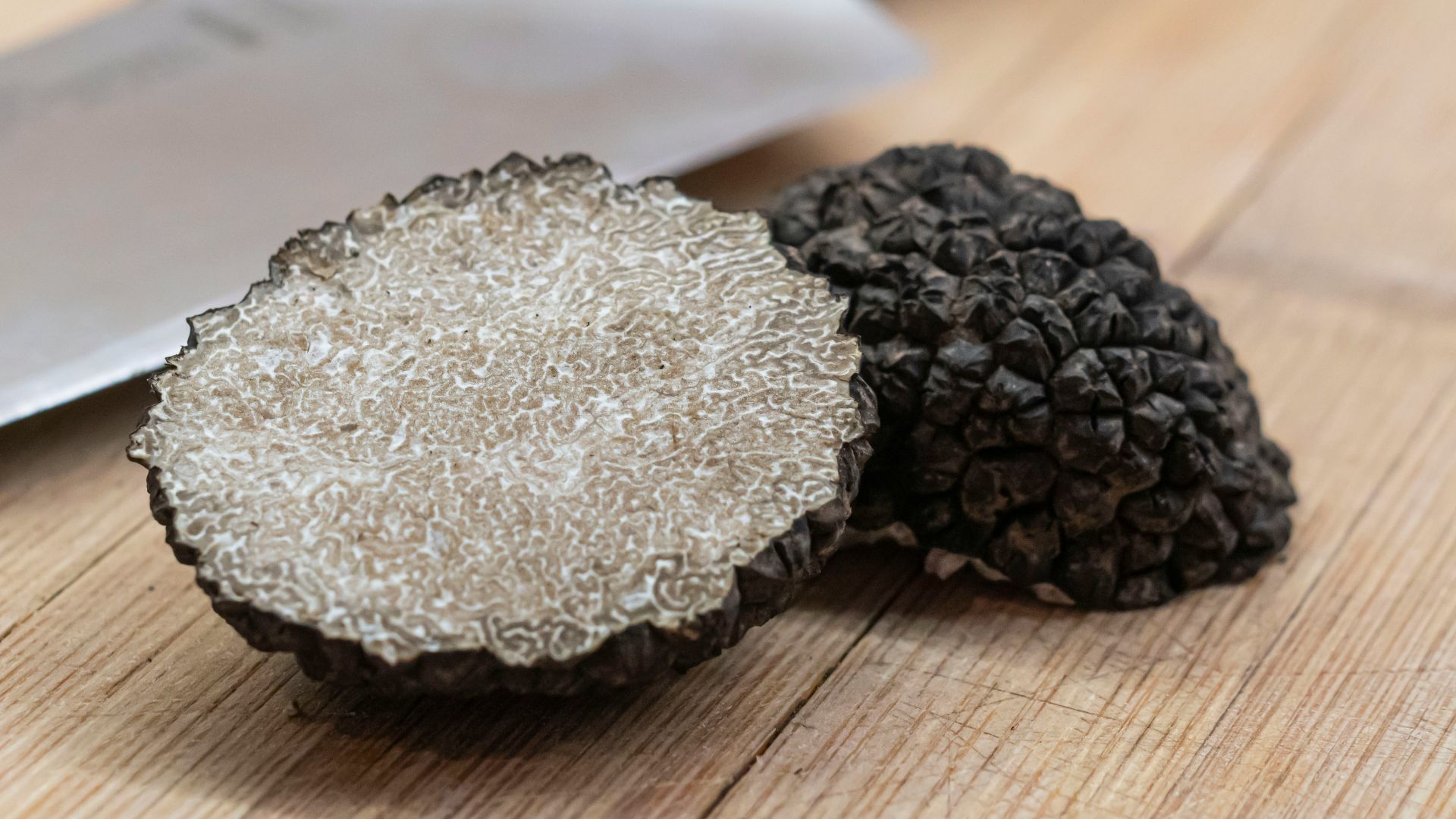 black and gray round ornament on brown wooden table
