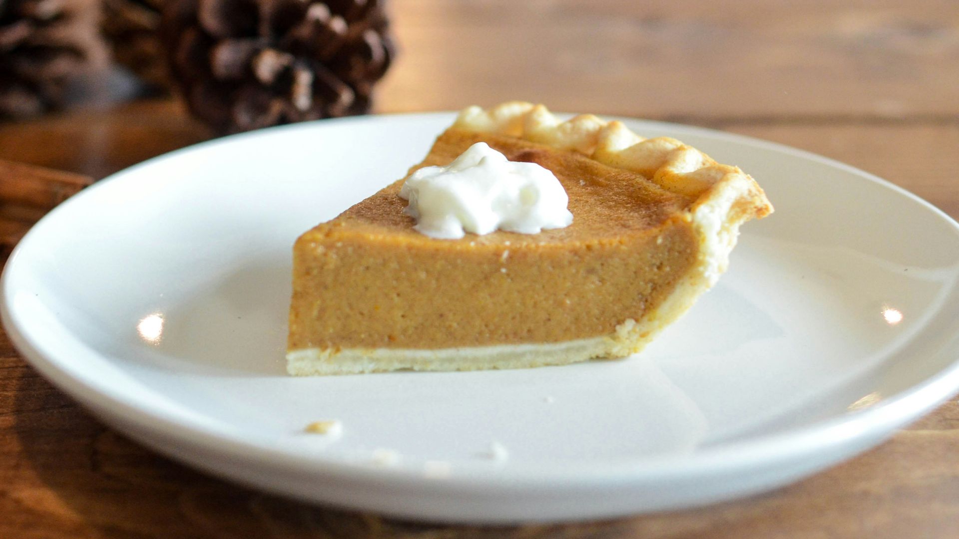 closeup photo of sliced pie on white ceramic saucer