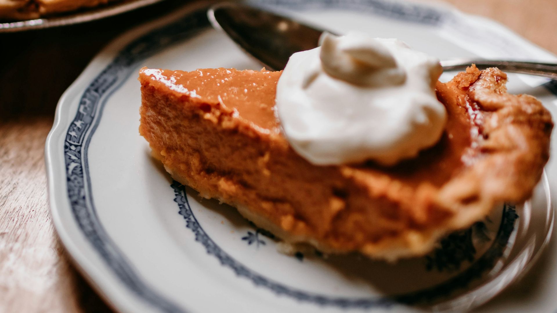 A piece of pie on a plate with a fork