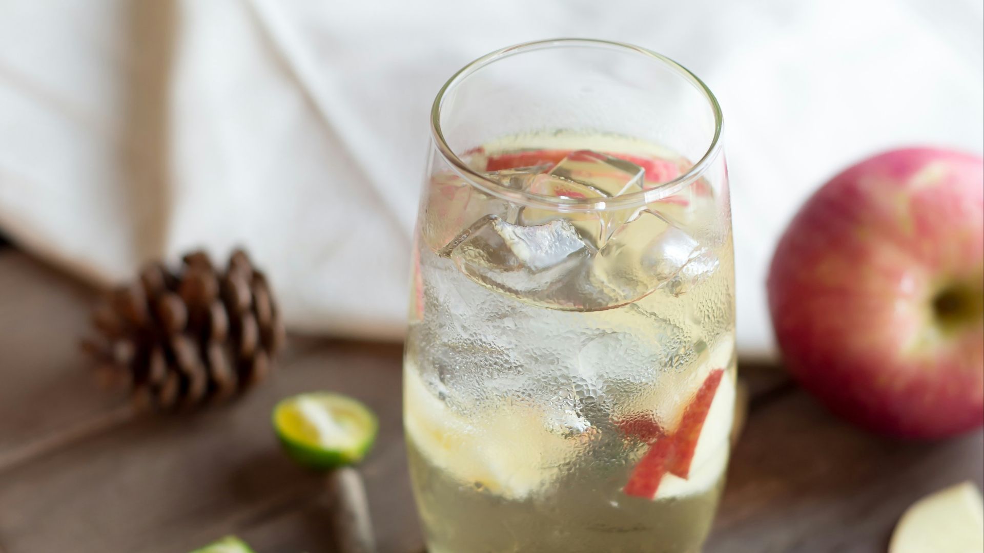 clear drinking glass with yellow liquid inside