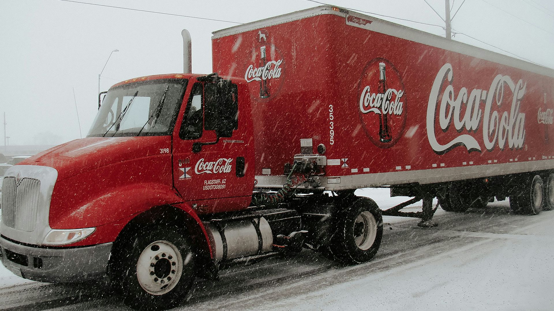 red Coca-Cola truck on road