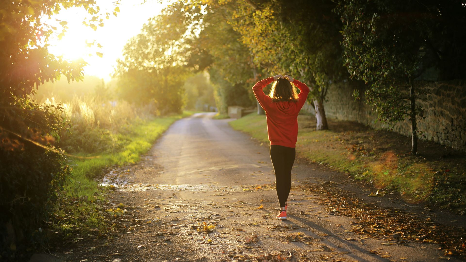 woman walking on pathway during daytime