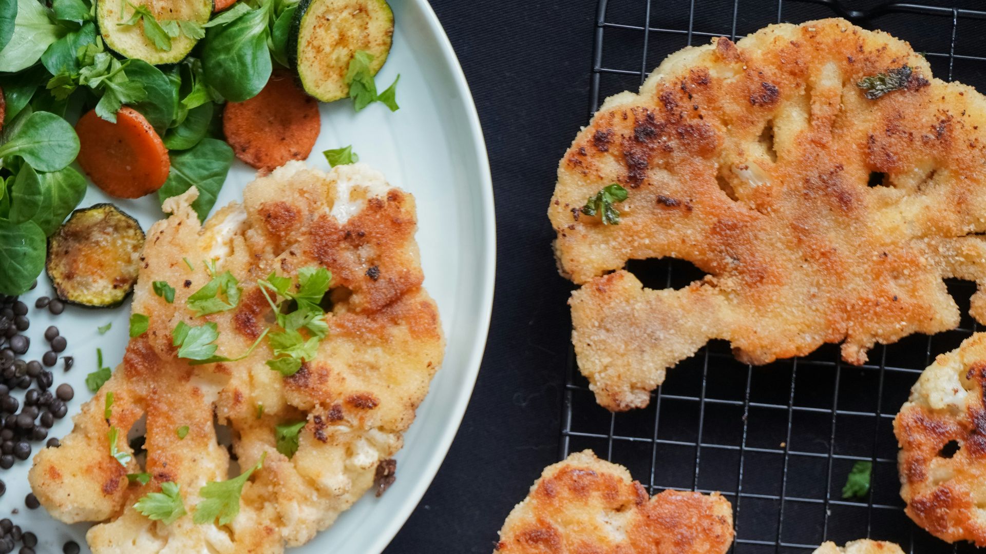 fried food with green vegetable on white ceramic plate