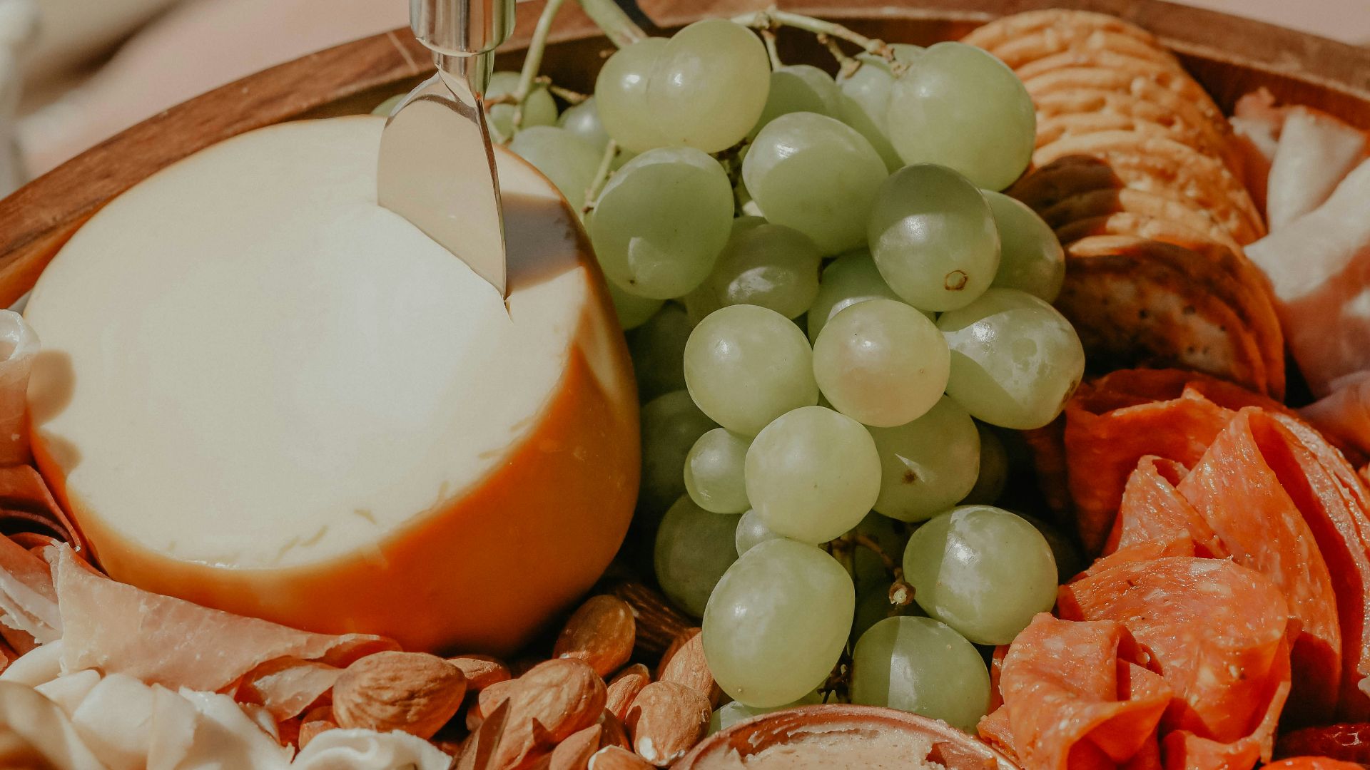 a close up of a plate of food with grapes