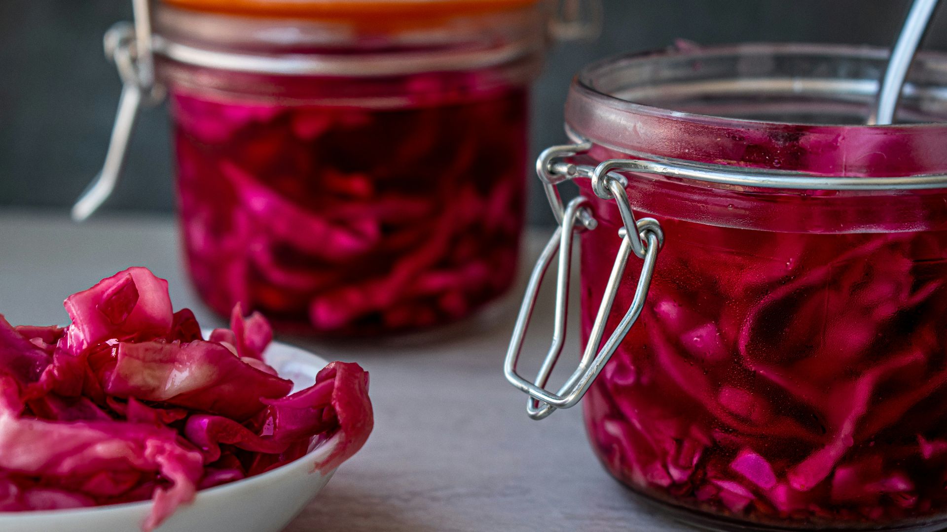 red liquid in clear glass jar