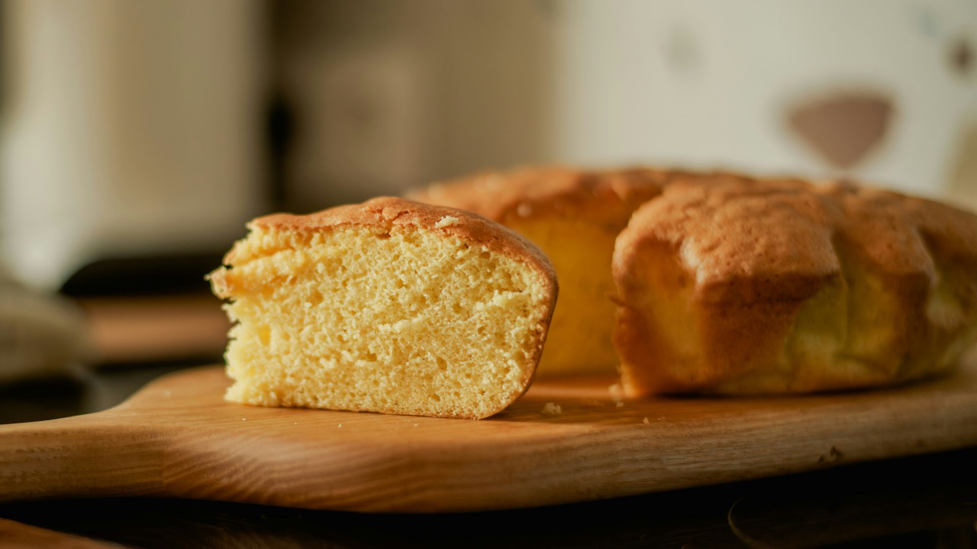 A loaf of bread sitting on top of a wooden cutting board