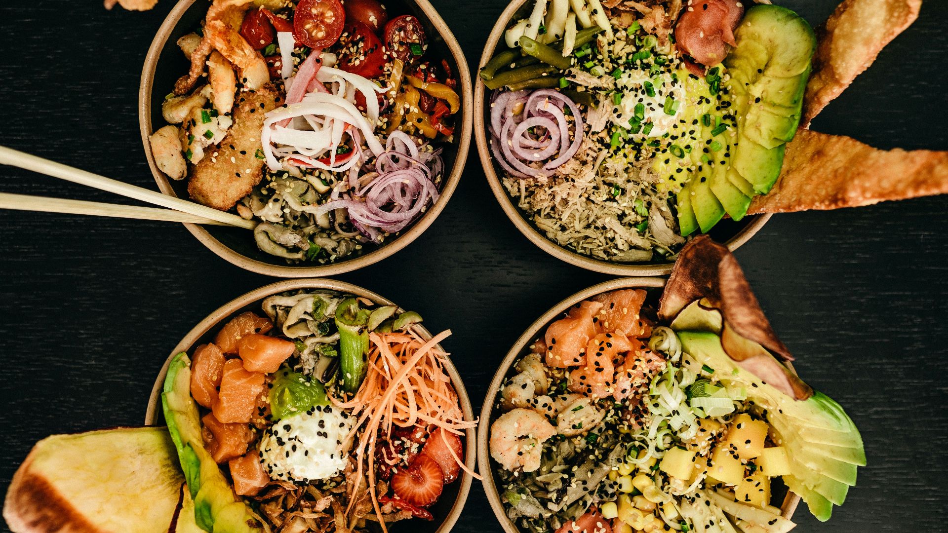 four assorted dishes on bowls