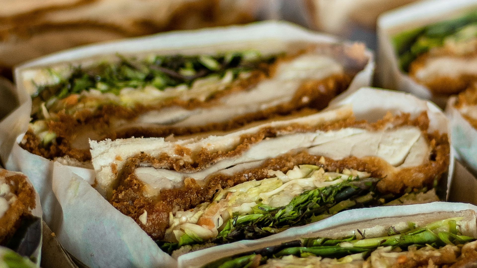 a close up of a tray of sandwiches