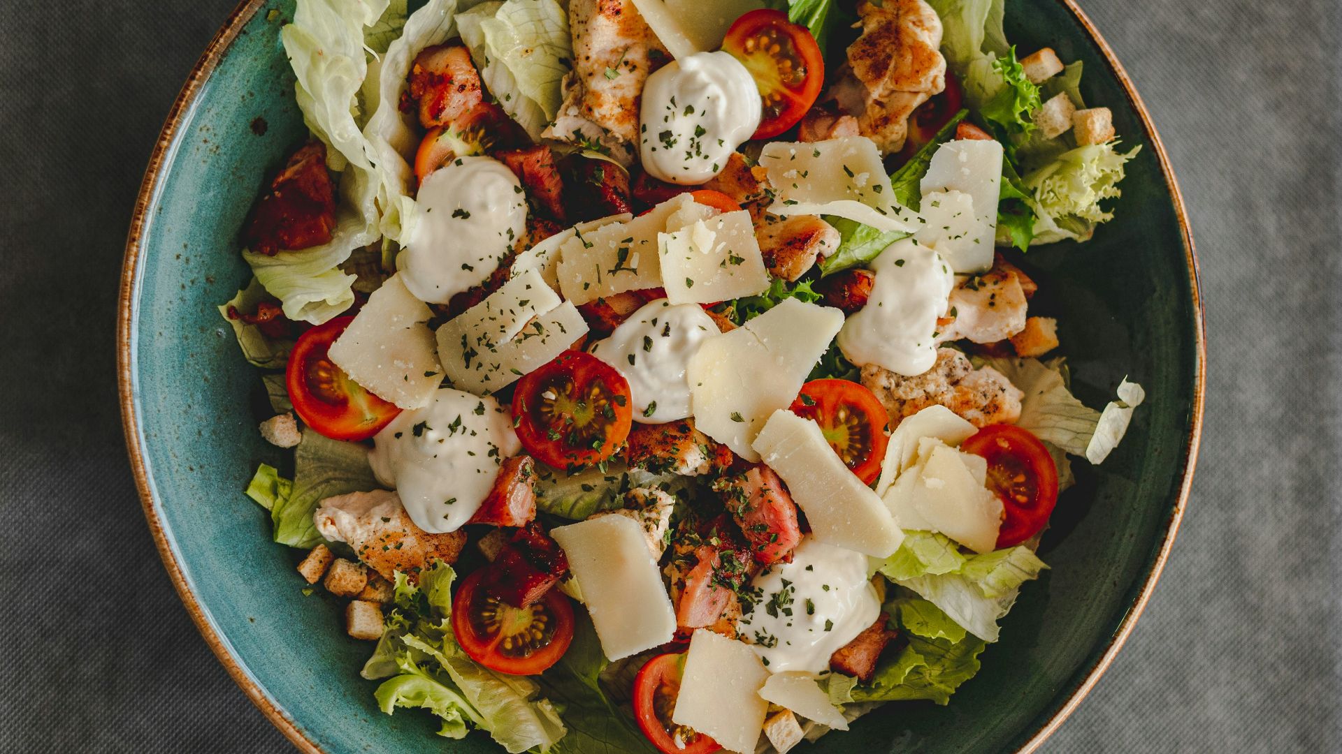 vegetable salad on blue ceramic bowl