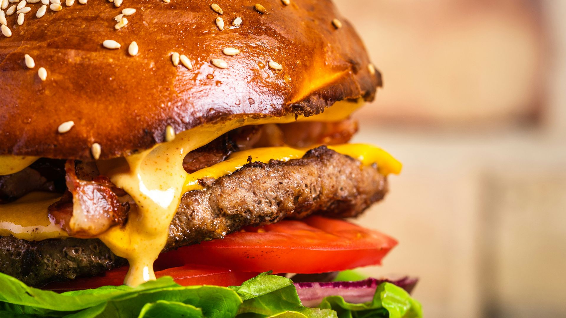 a cheeseburger with a sesame seed bun