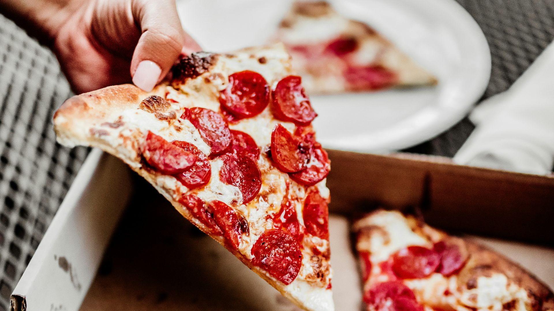 sliced pizza on white ceramic plate