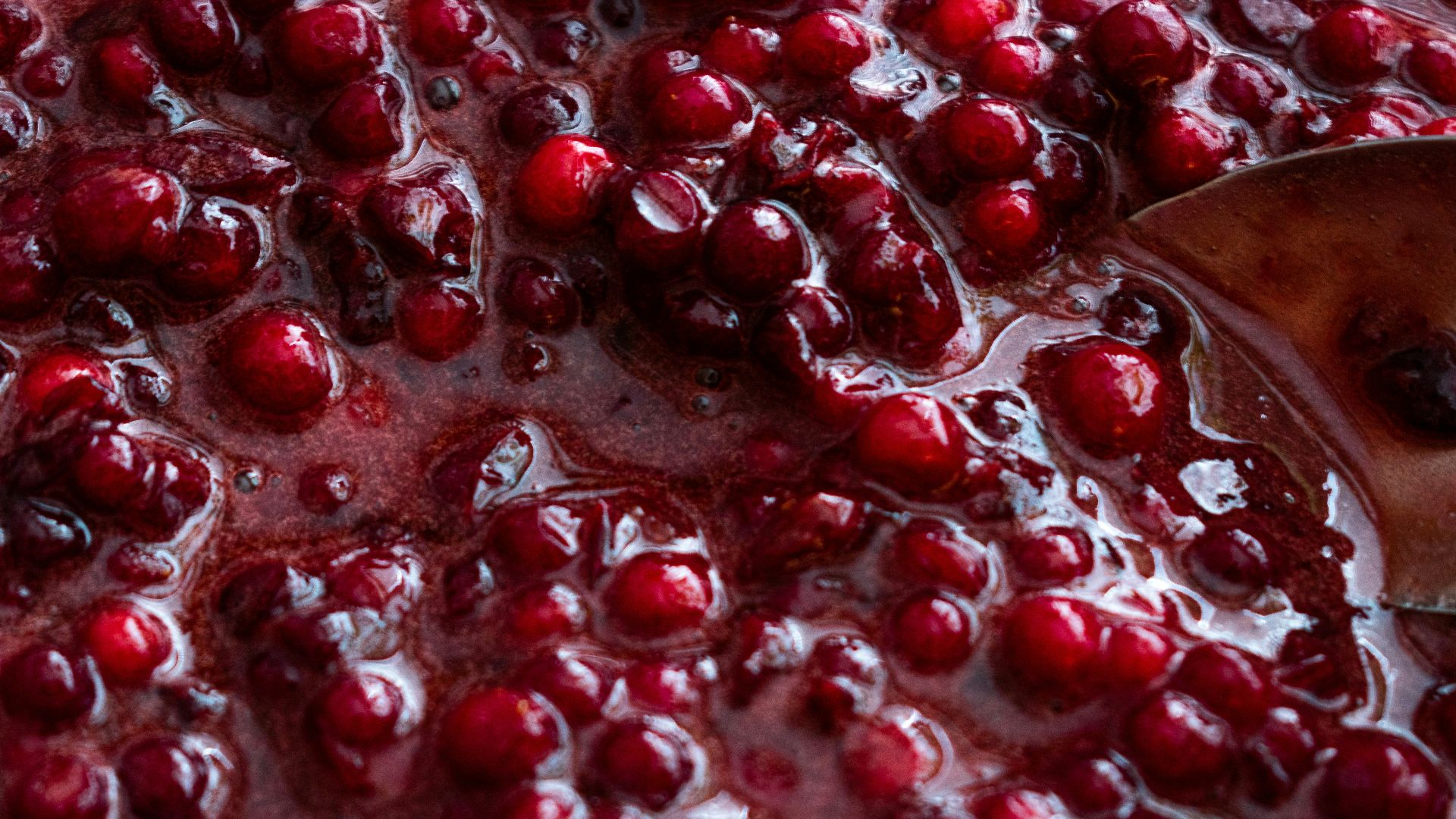 red liquid in clear glass
