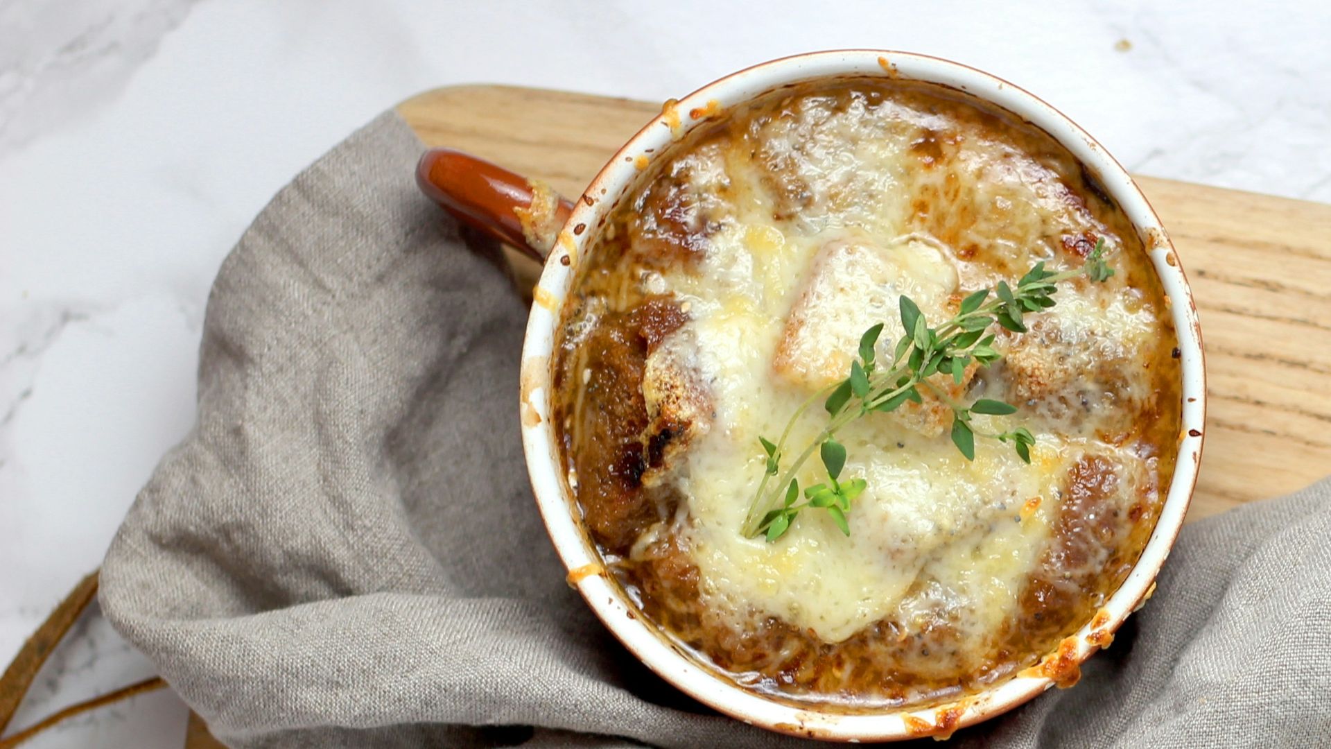 soup with green leaf in teacup