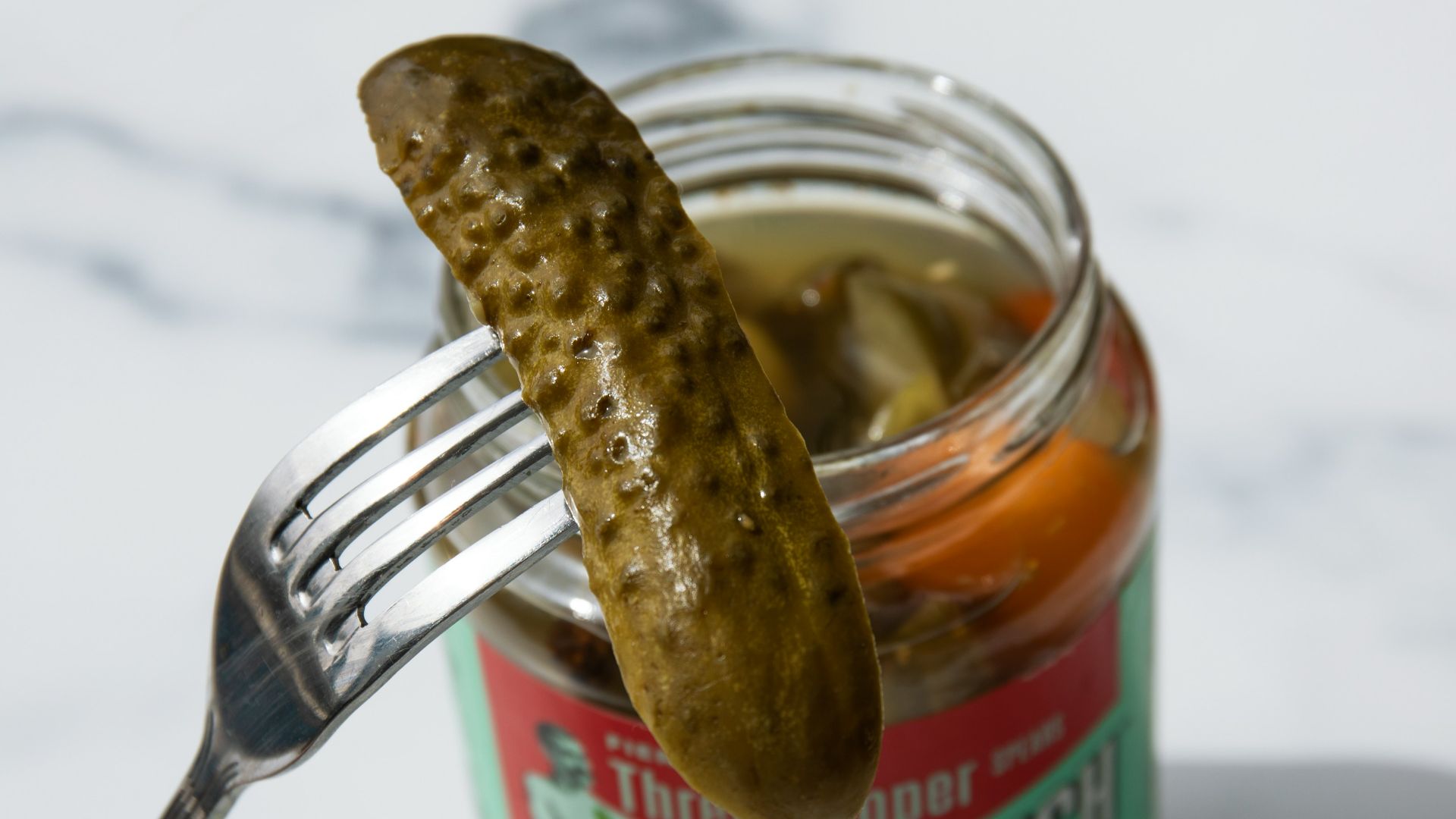 stainless steel fork on green labeled can