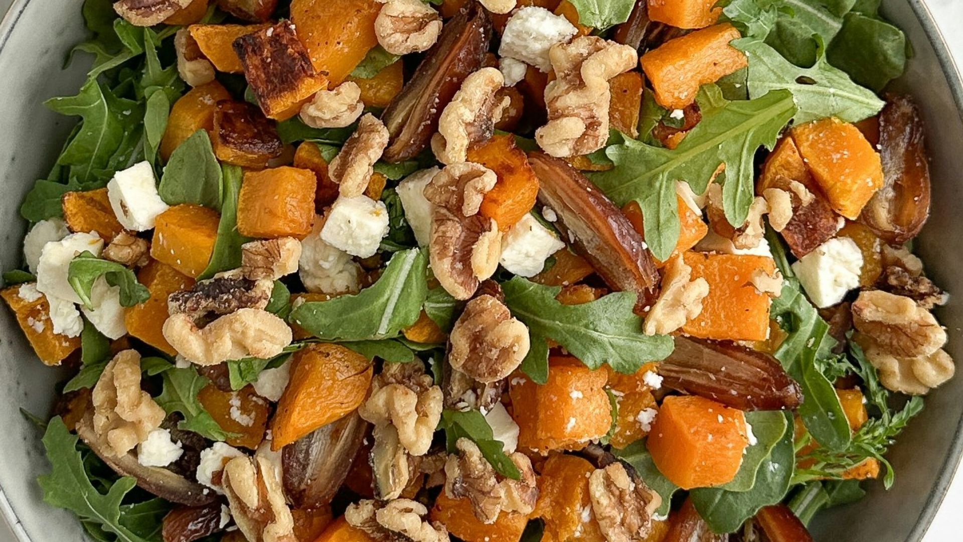 Arugula salad with roasted butternut squash and walnuts