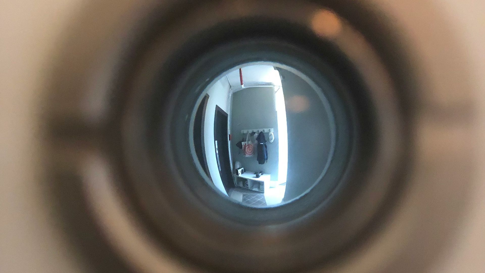 a close up of a toilet bowl with a reflection of a person in it