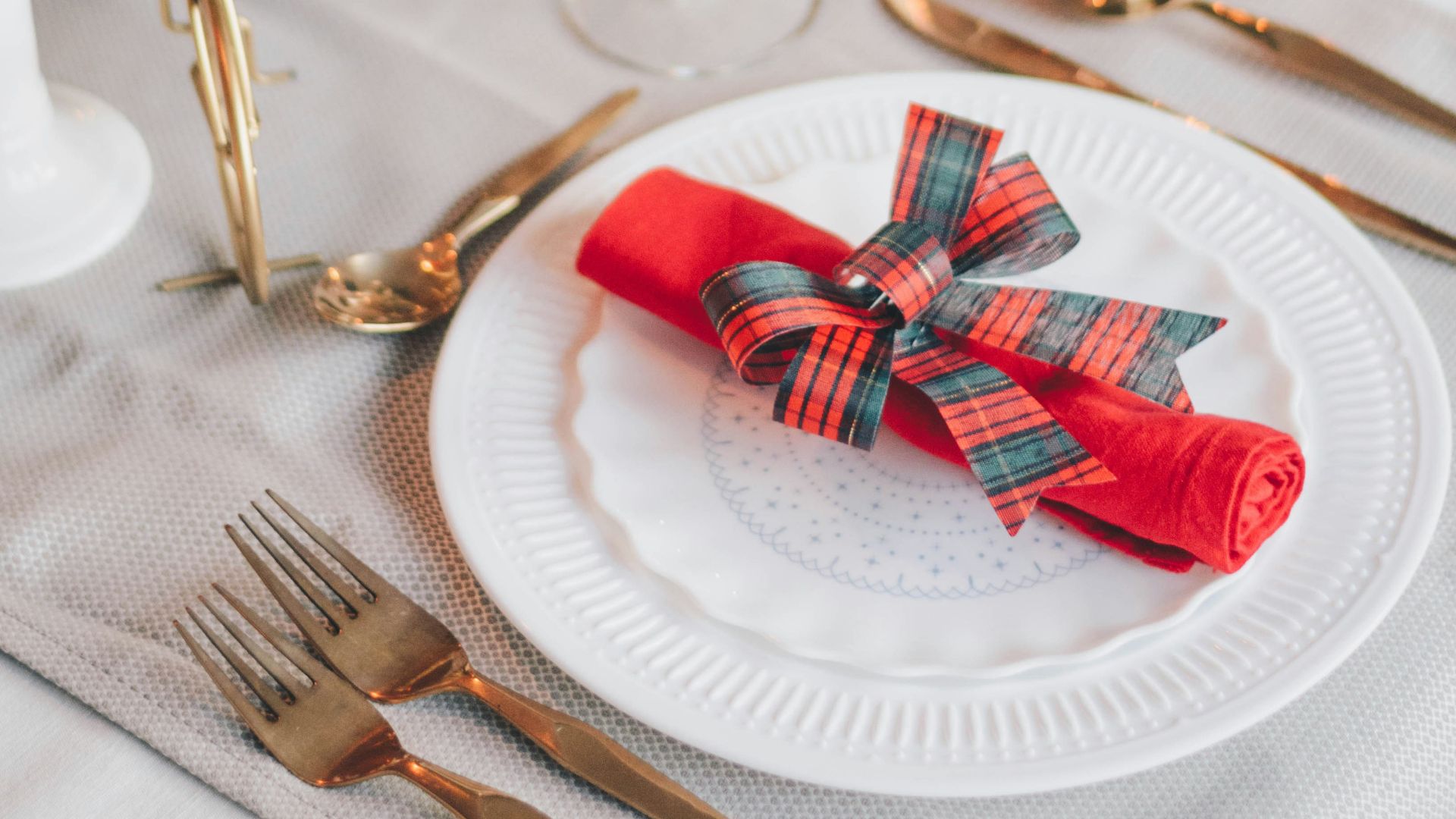 red and white ribbon on gold round tray