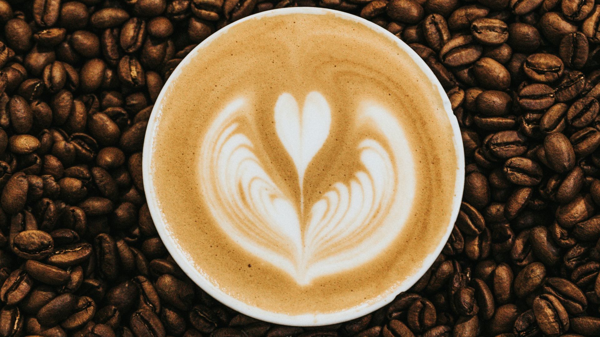 top view photography of heart latte coffee