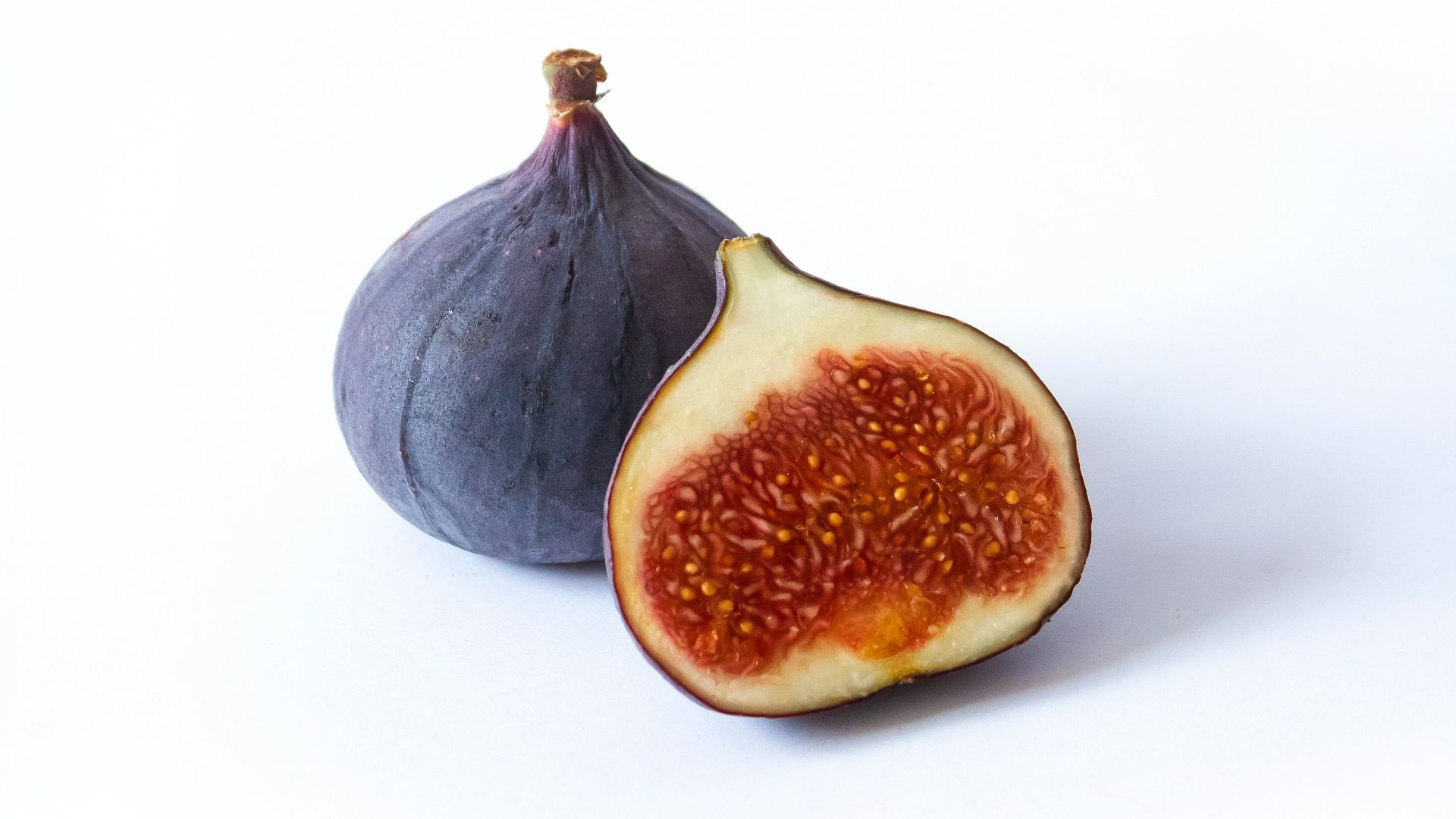 black round fruit on white background