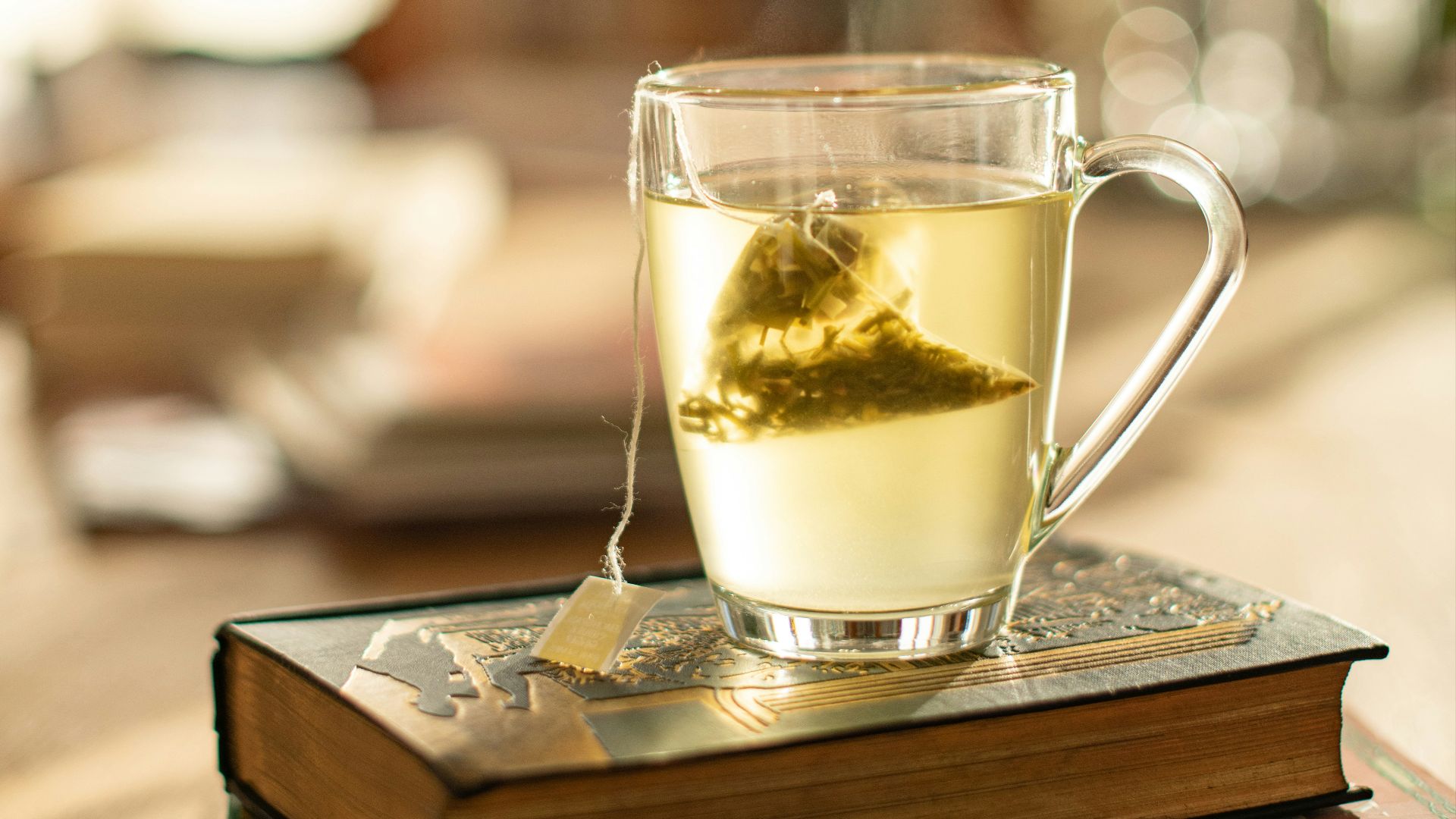 clear glass mug on brown wooden table