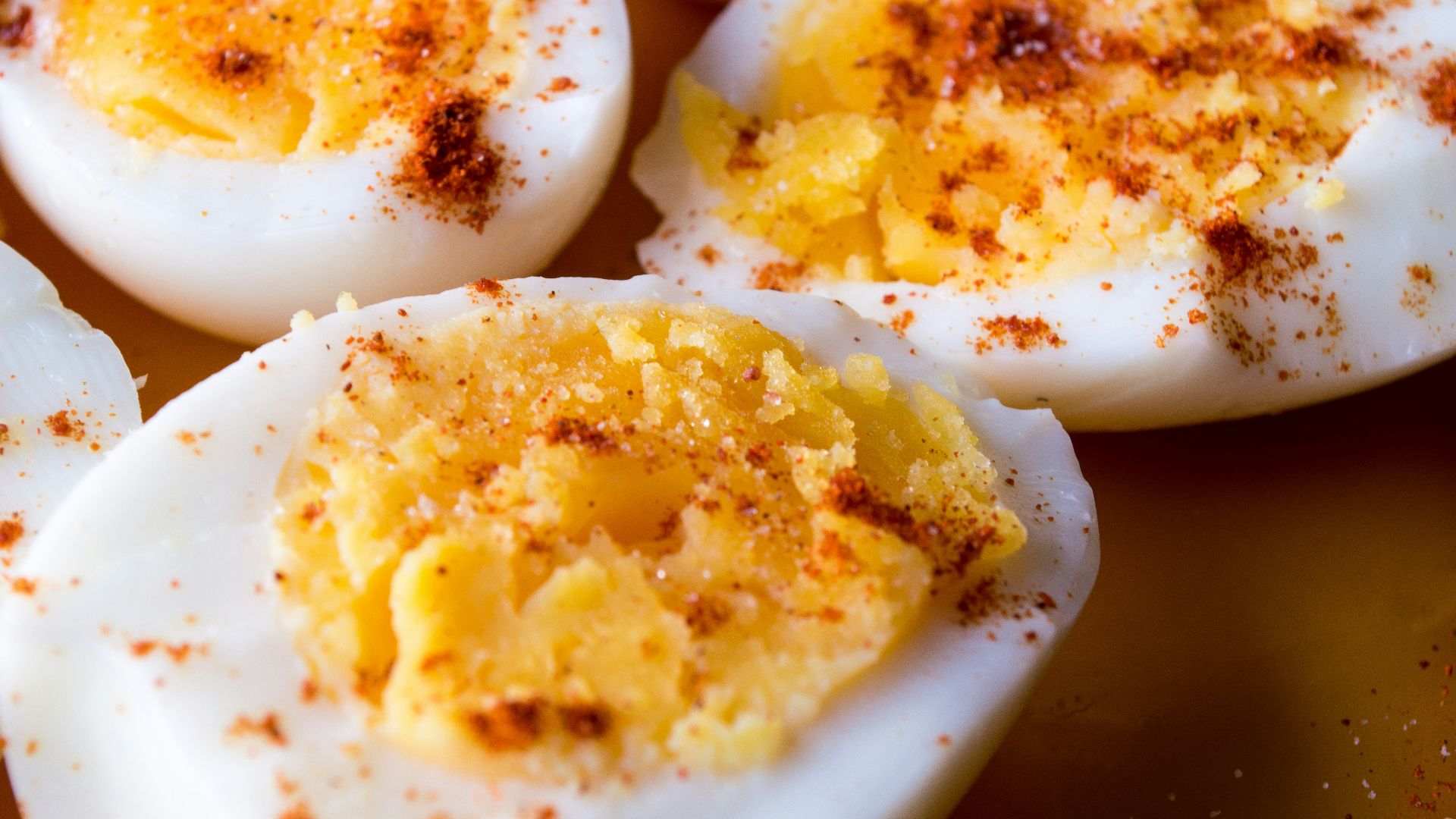 sliced boiled eggs topped with spices