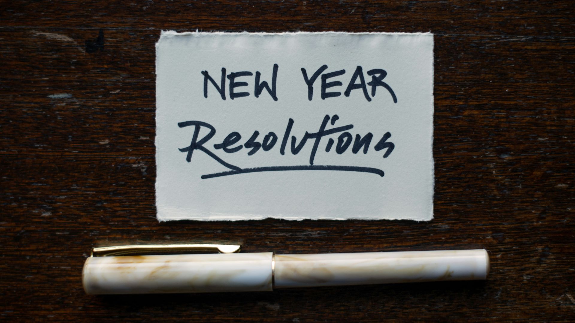 white printer paper on brown wooden table