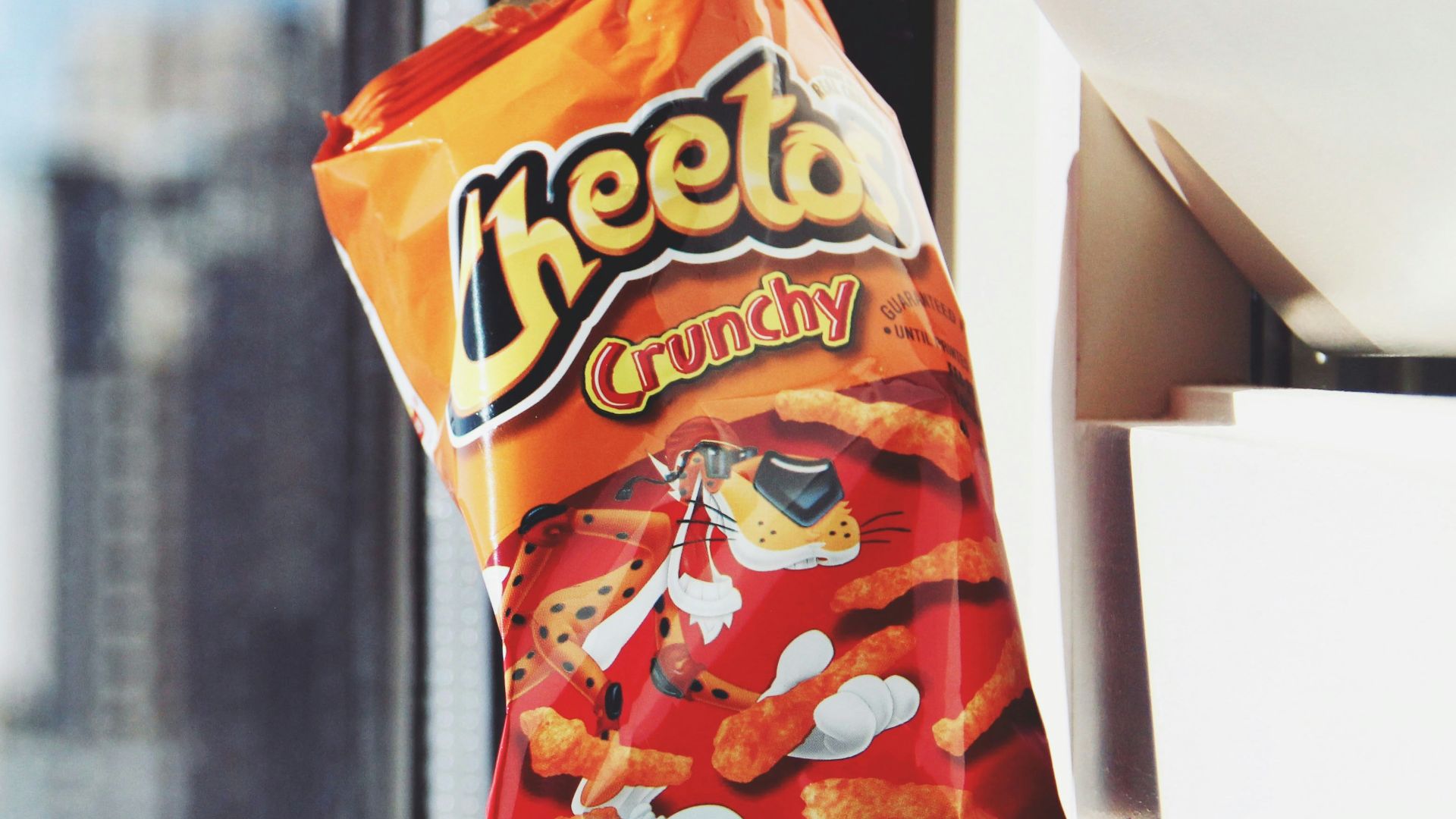 orange and yellow plastic pack on white table