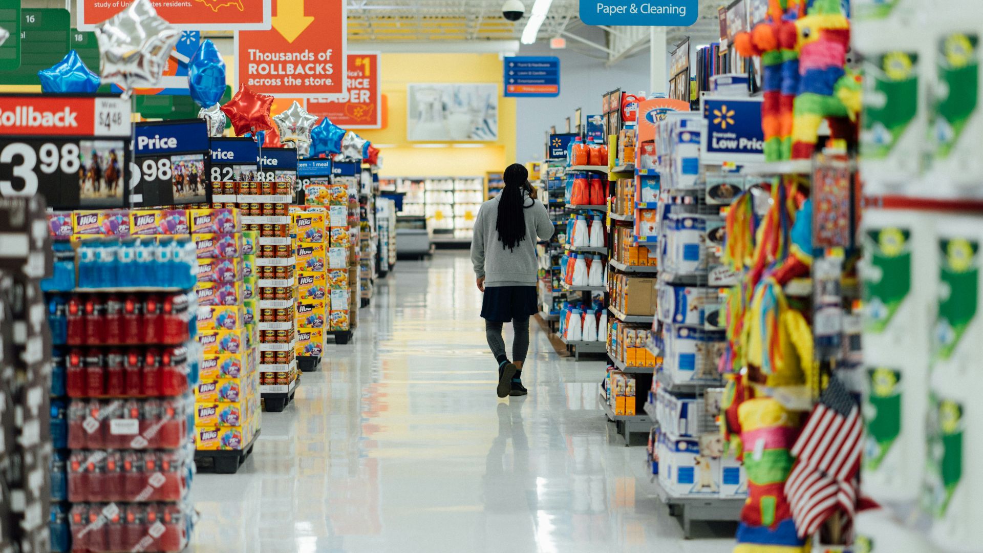 person standing between shelvings