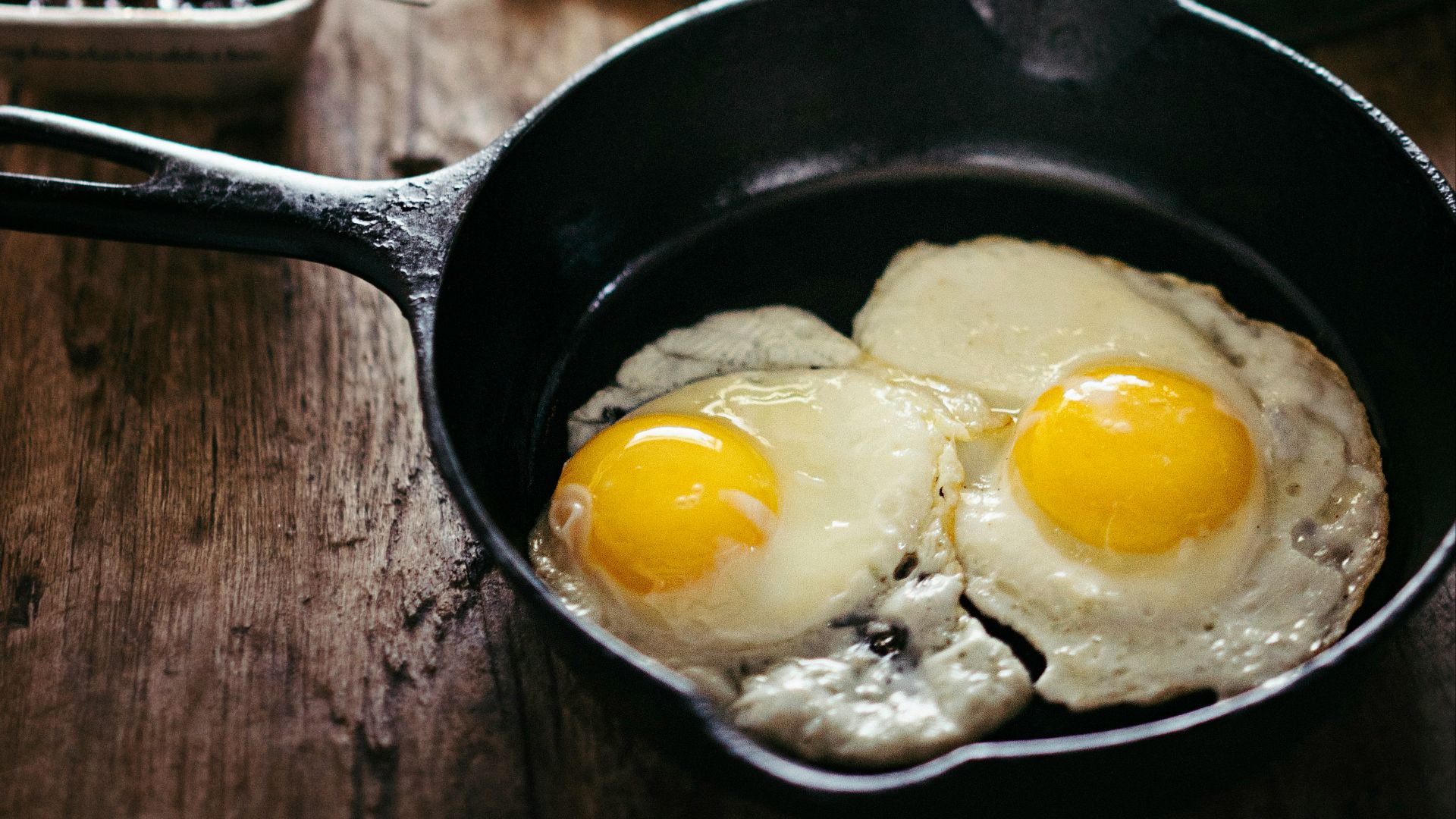 two fried eggs on skillet