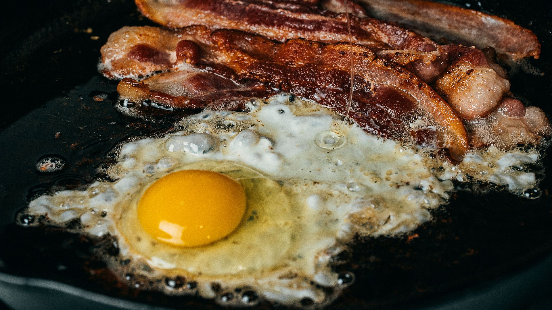 fried egg on black pan