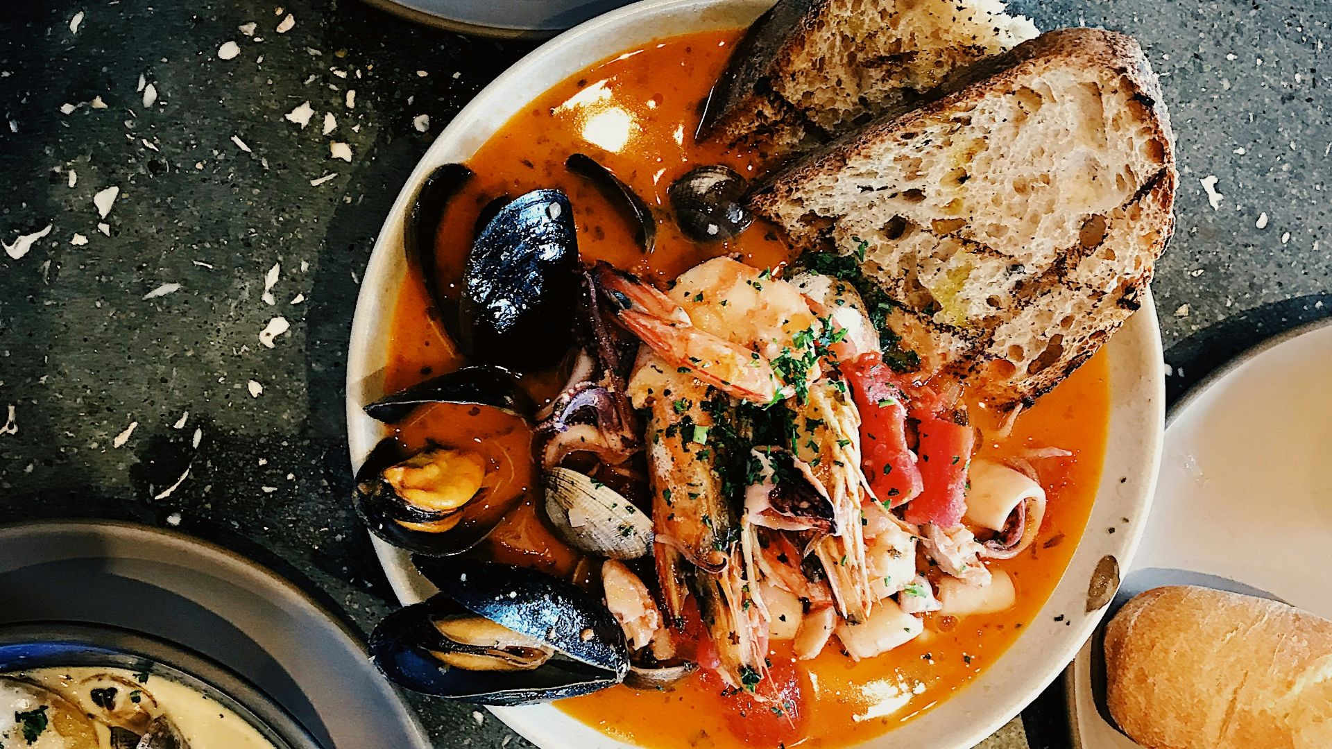round white ceramic bowl with seafoods
