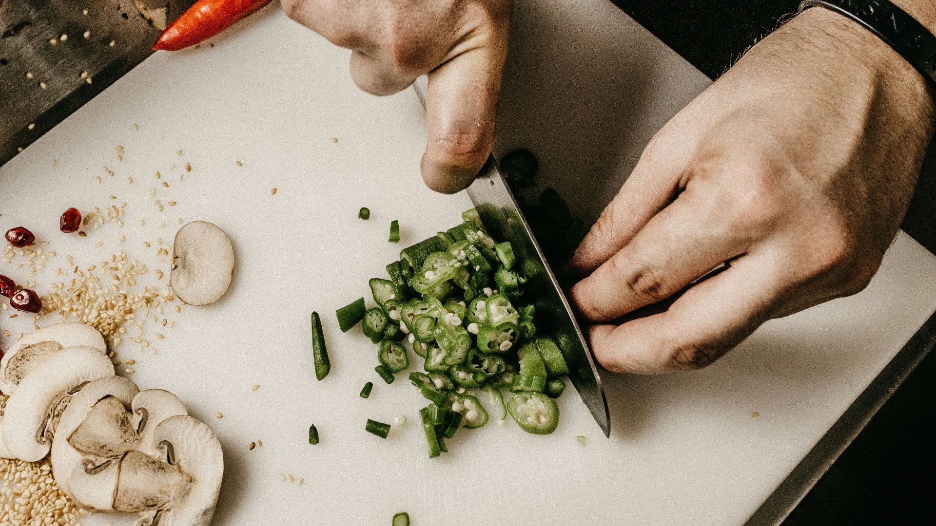 person slicing vegetable