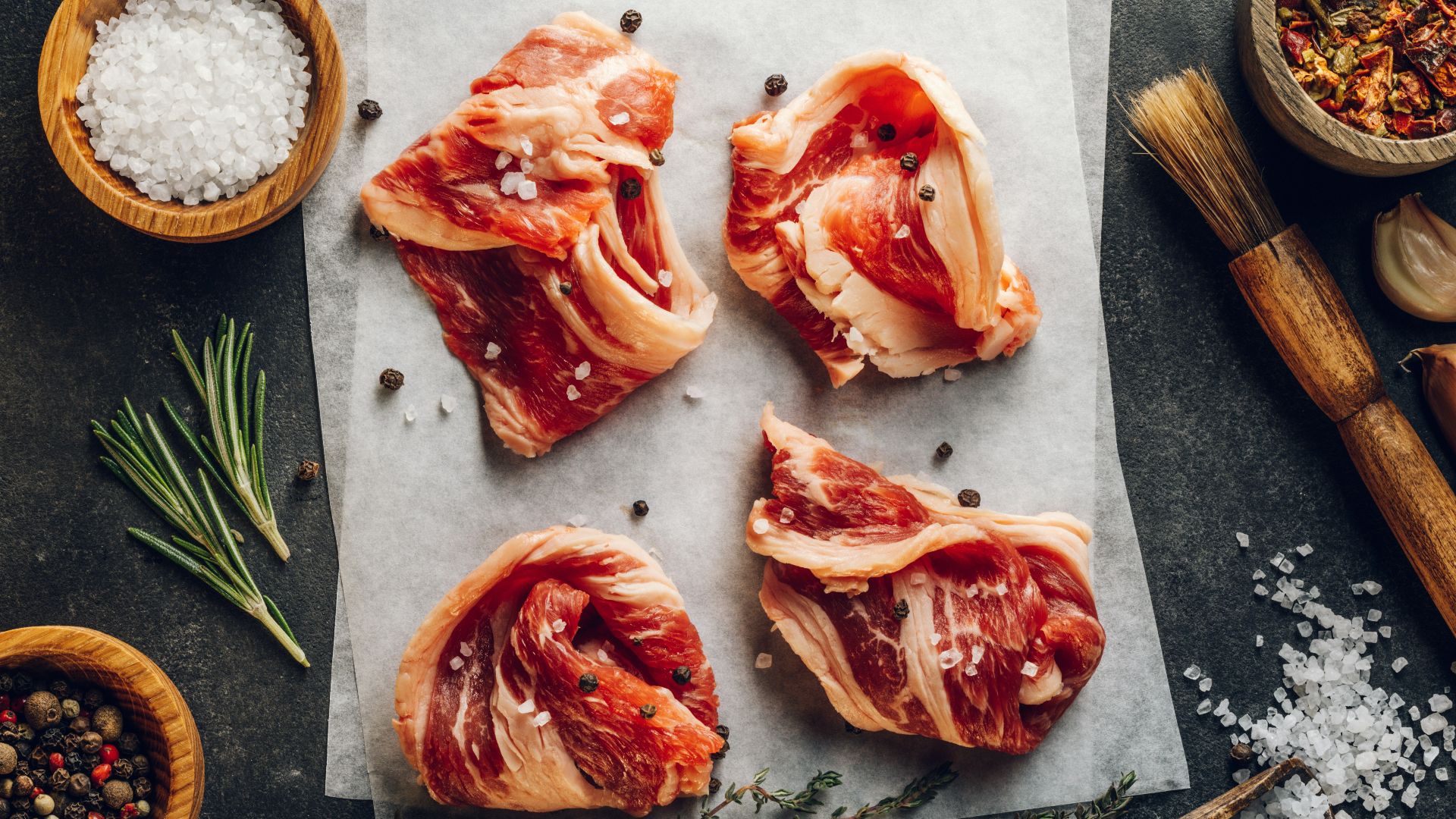 a group of raw fish on a cutting board