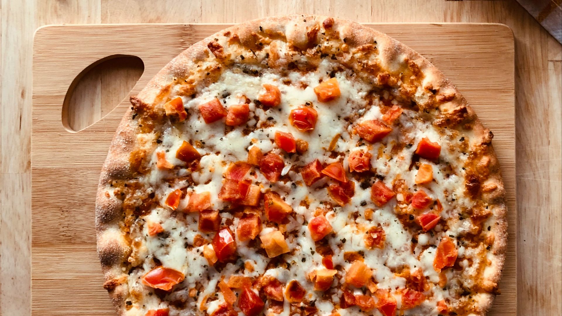 pizza on brown wooden table