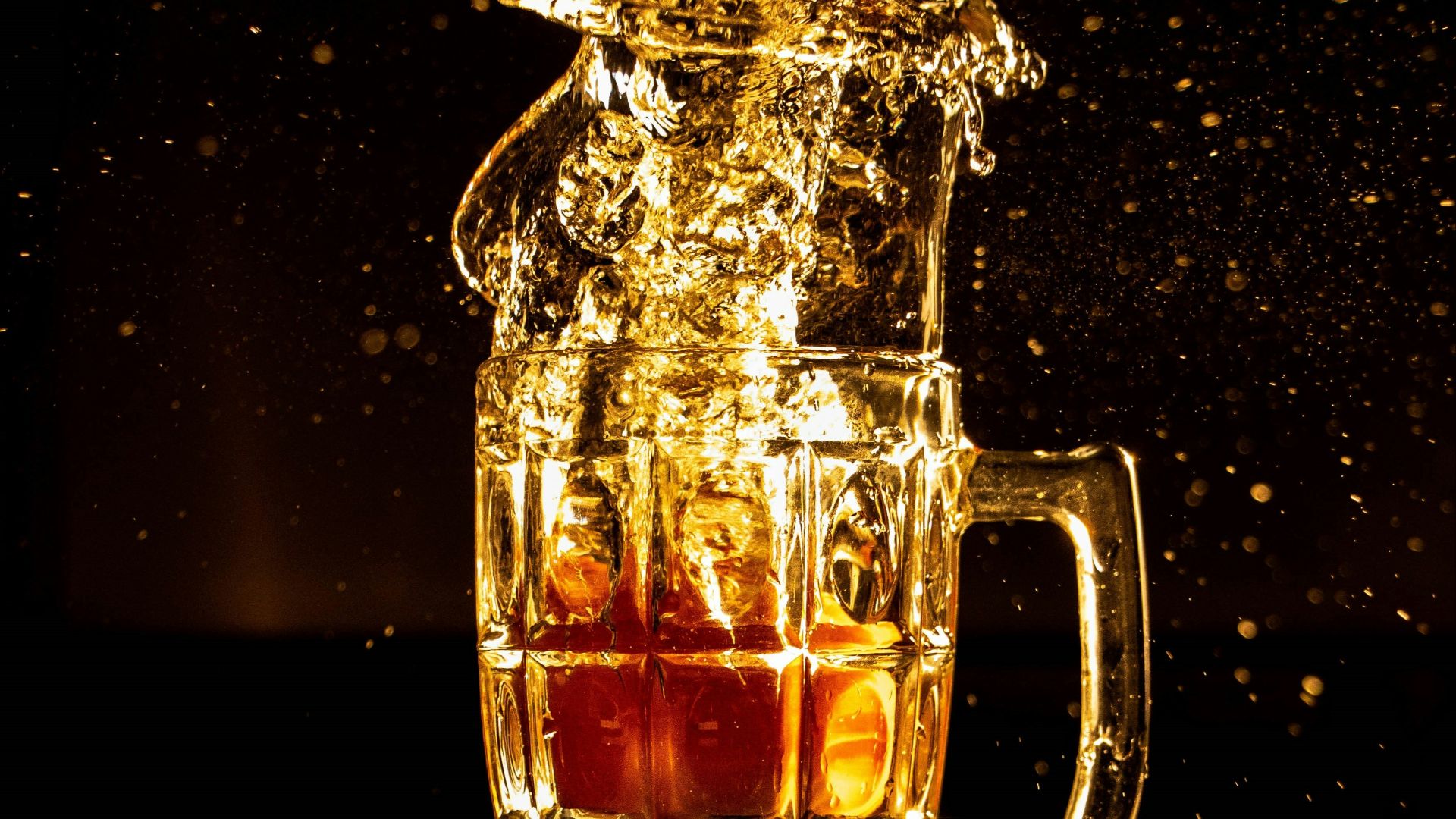 clear glass mug with brown liquid