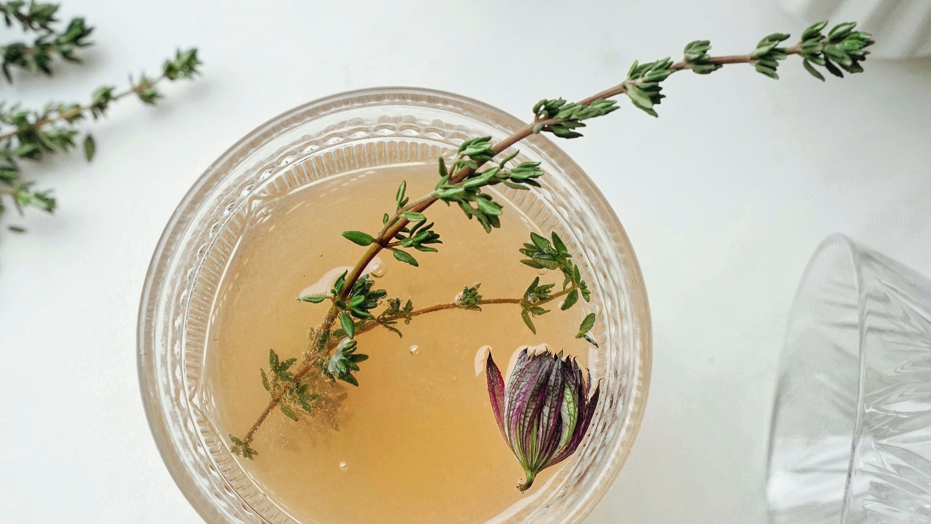 clear glass cup with brown liquid inside