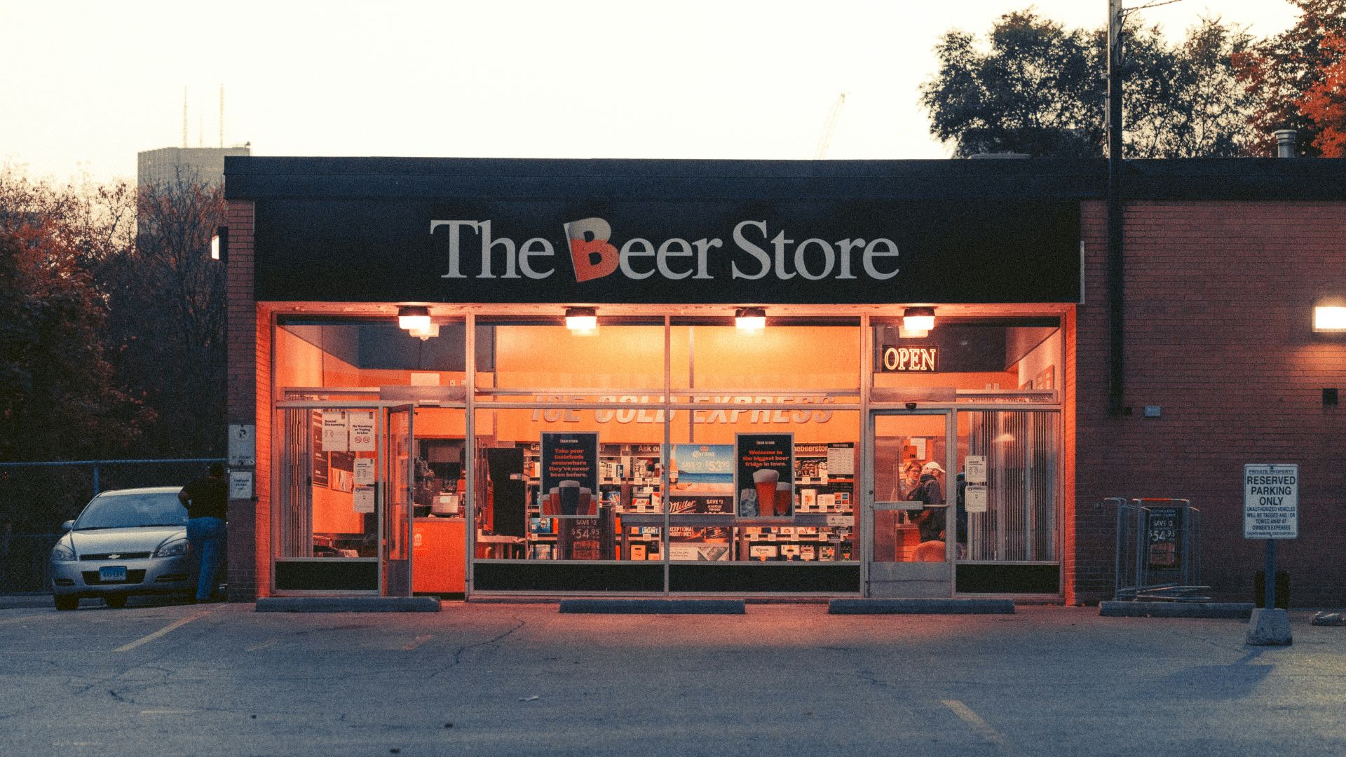 a store front with a parking lot